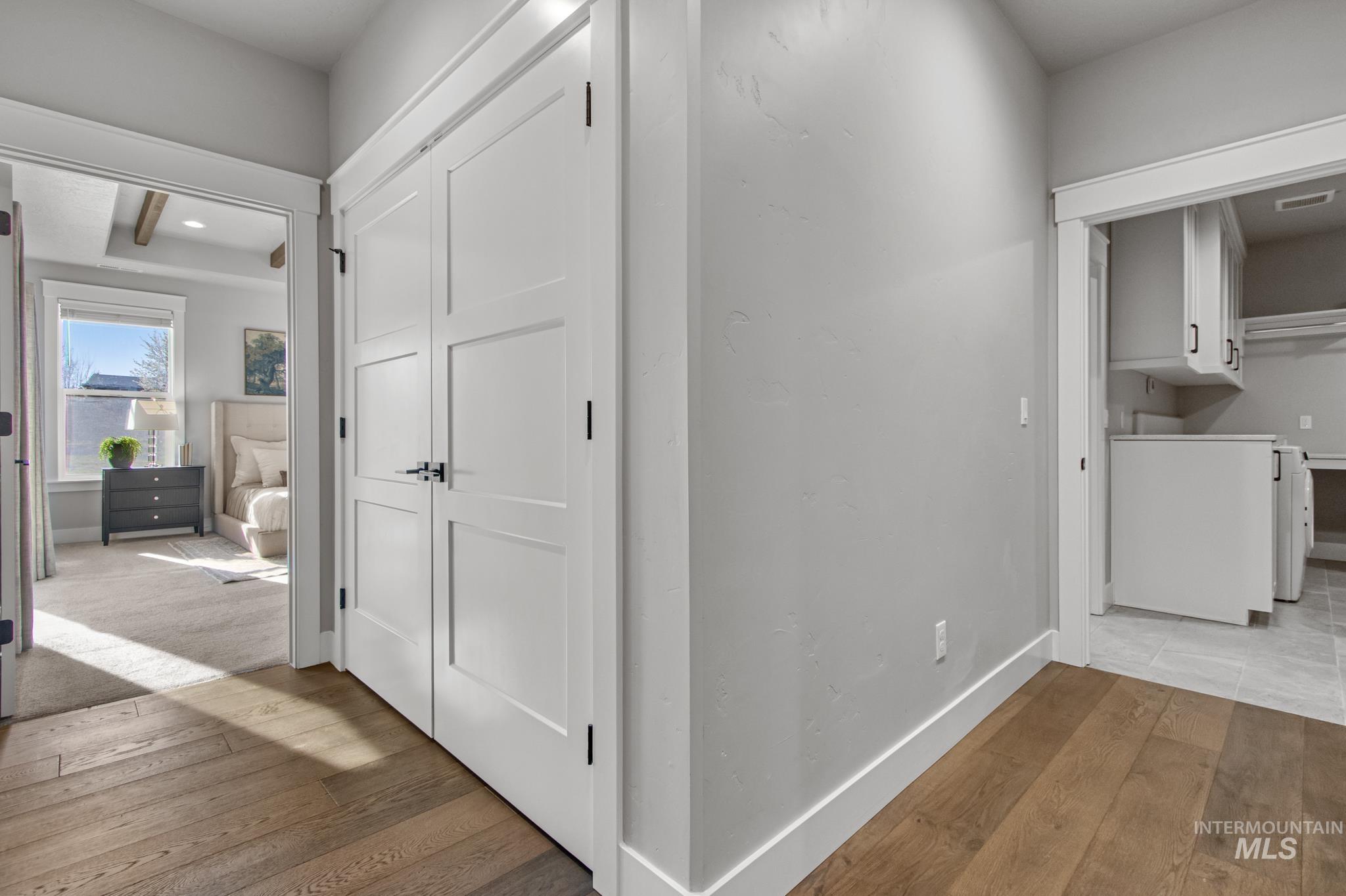 Corridor featuring light wood-style flooring, recessed lighting, and washer / clothes dryer