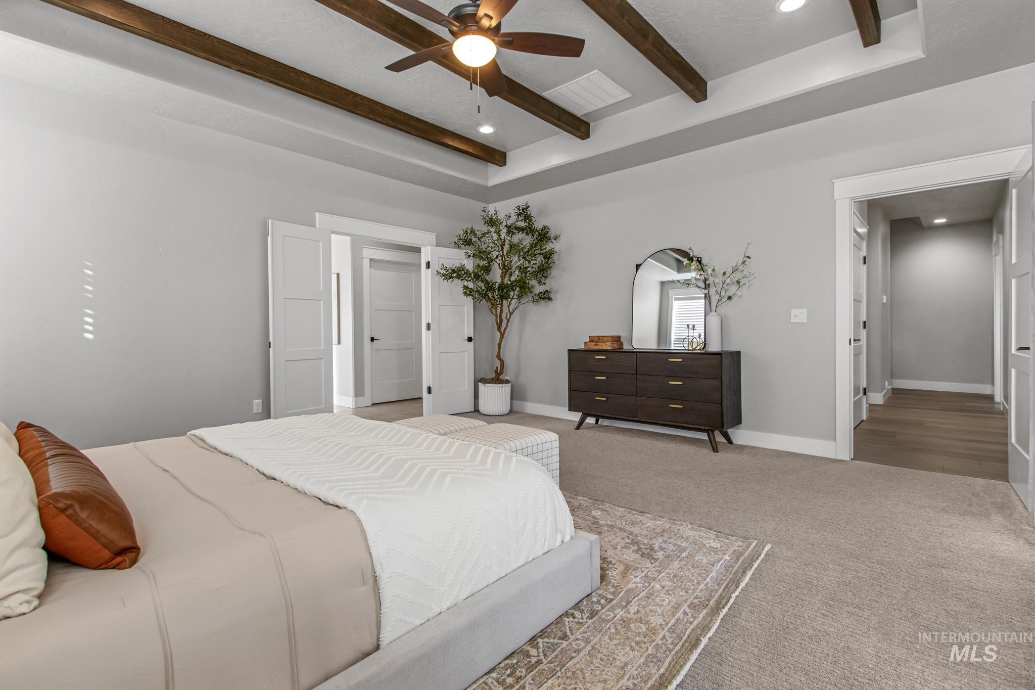 Carpeted bedroom featuring recessed lighting, beamed ceiling, and ceiling fan