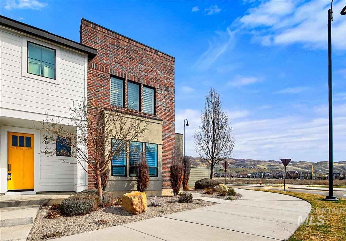 View of front of home featuring brick siding and a mountain view