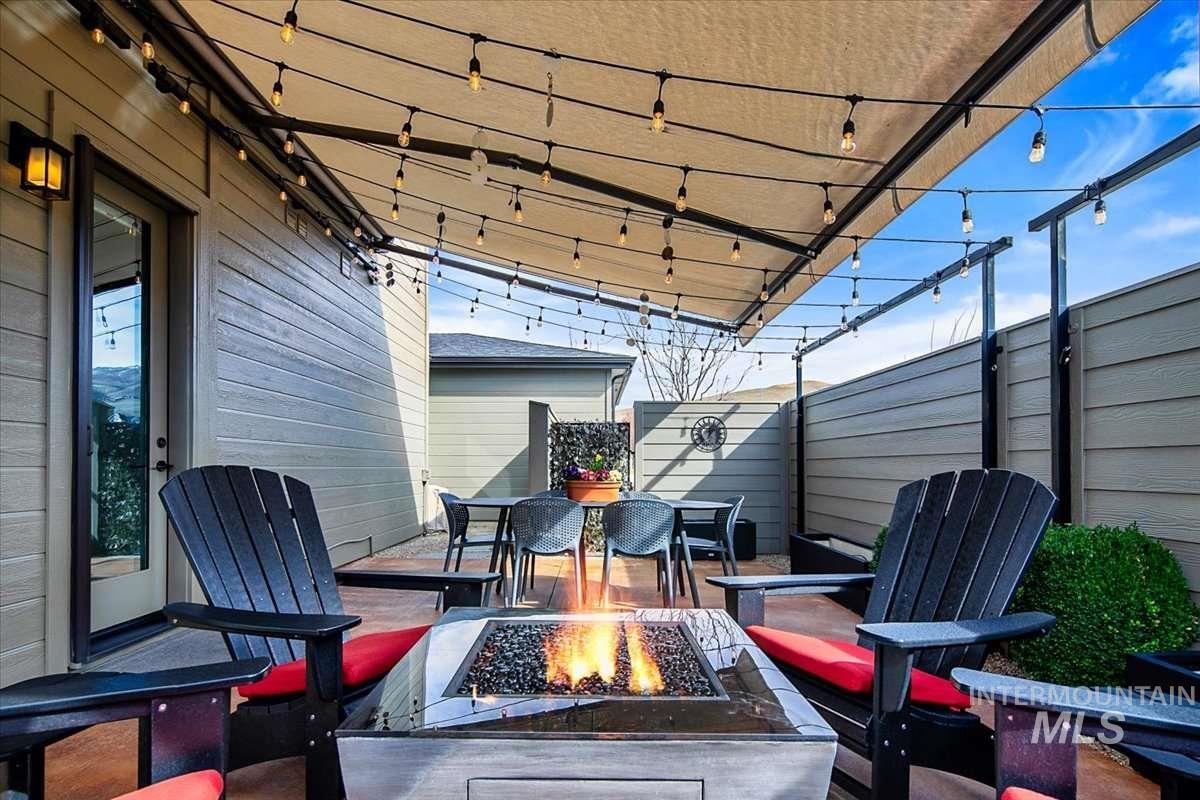 View of patio / terrace featuring a fire pit and outdoor dining space