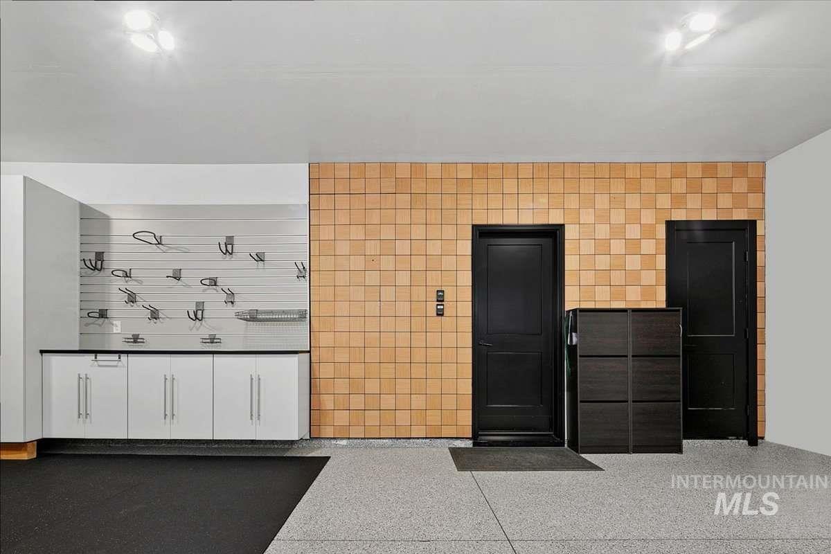 Misc room with light speckled floor