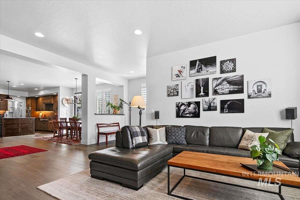 Living area featuring wood finished floors and recessed lighting