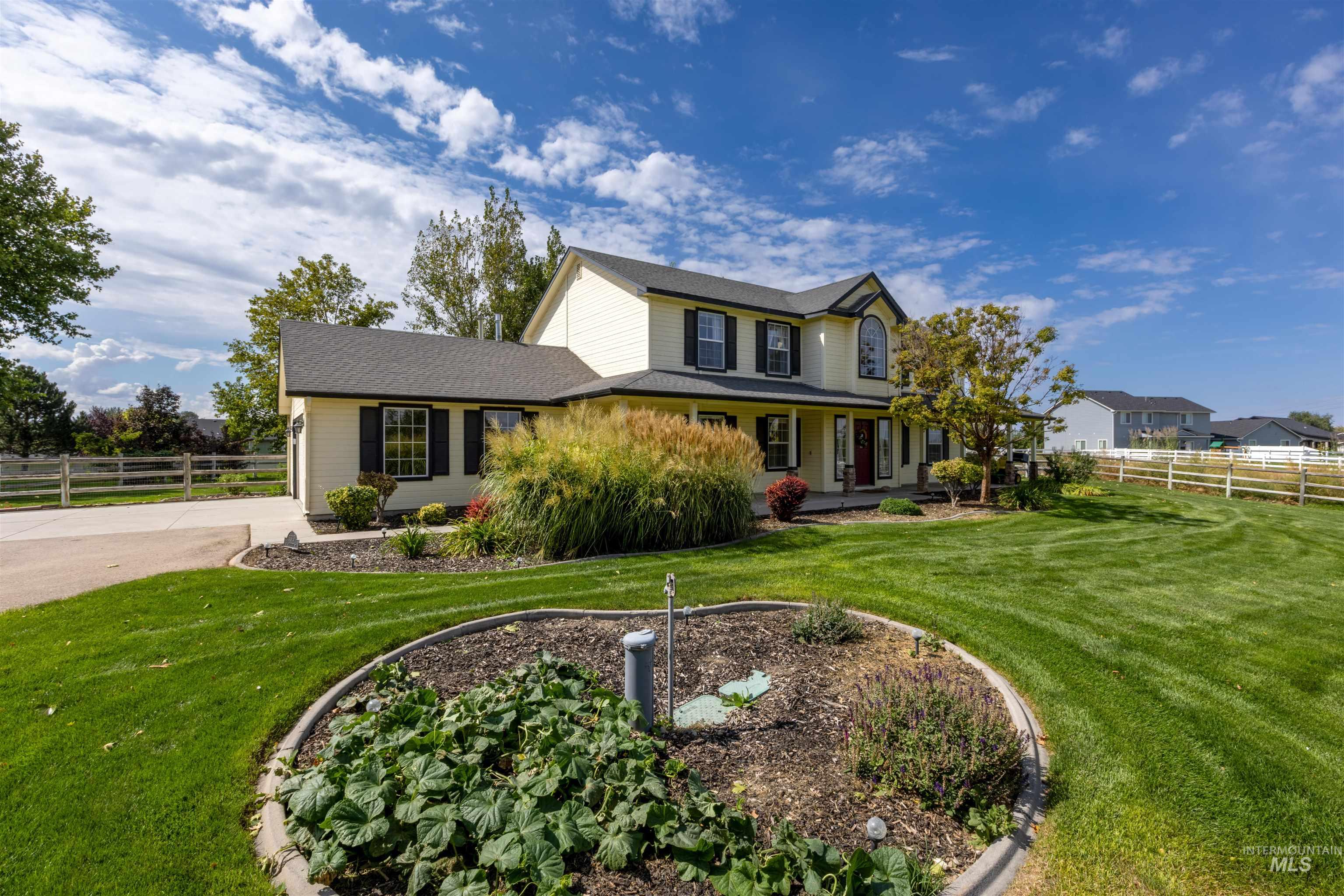 View of front of home featuring covered porch and a shingled roof
