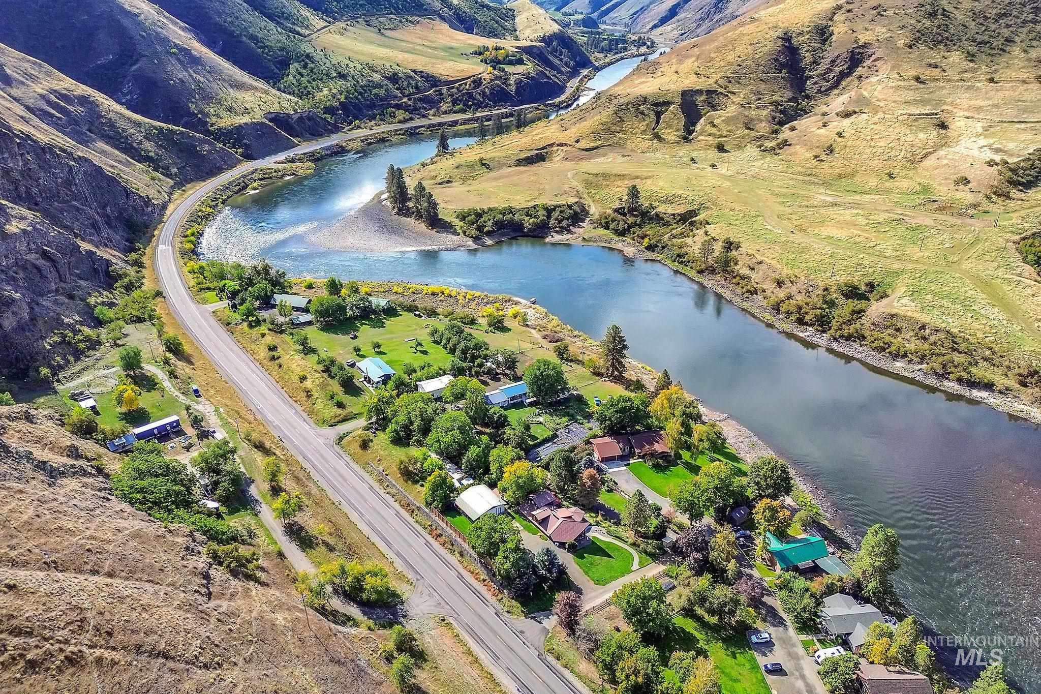 Aerial overview of property's location with a nearby body of water