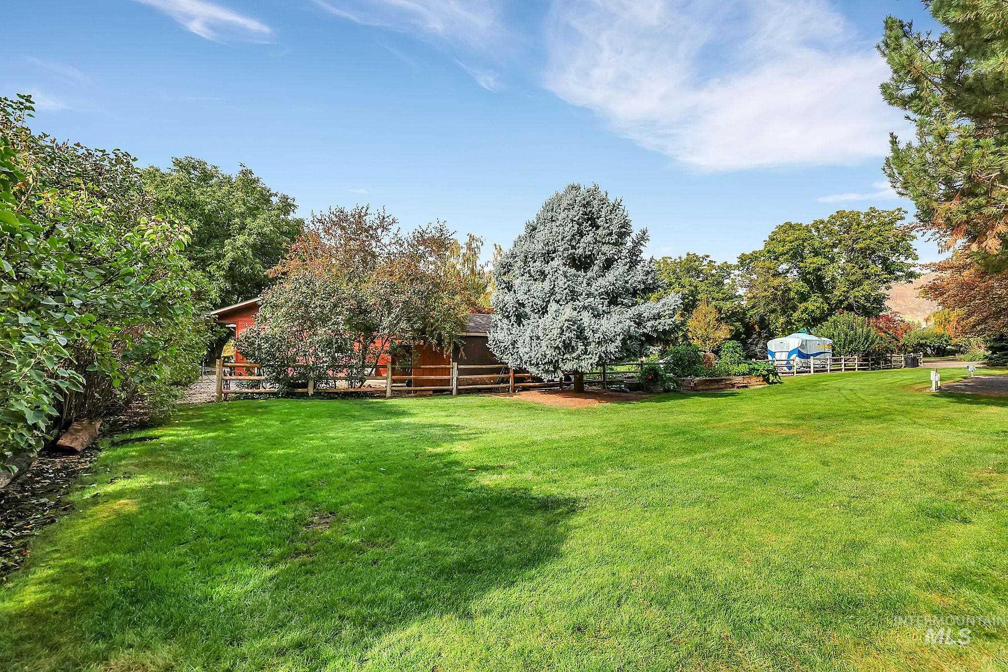 View of yard with a rural view