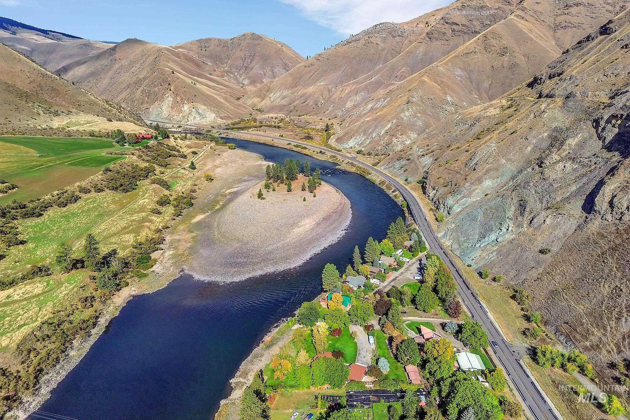 View of property location featuring a water and mountain view