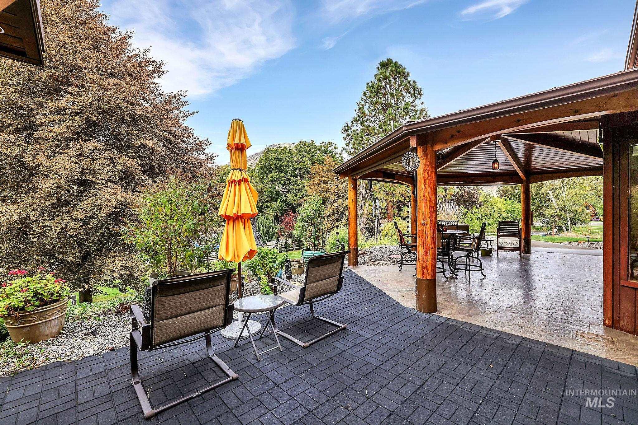 View of patio / terrace with a gazebo and outdoor dining area