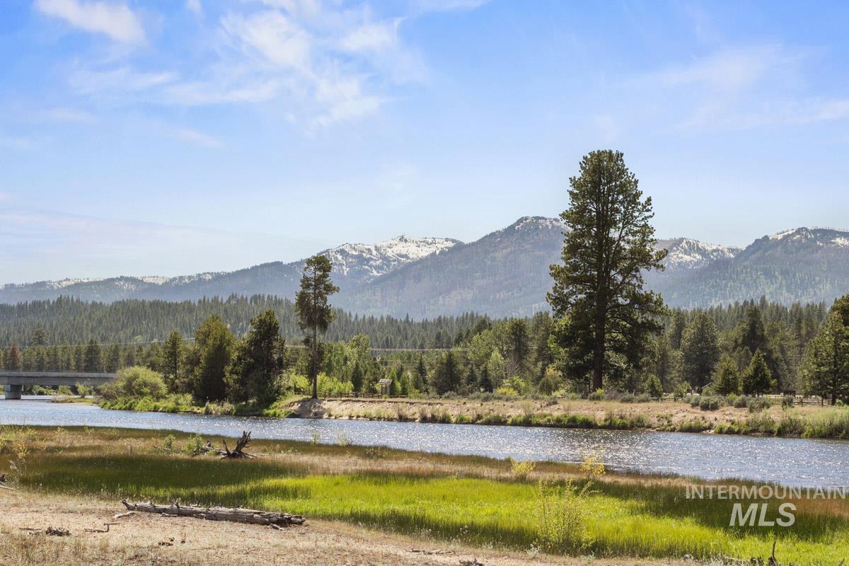 Mountain view with a heavily wooded area and a nearby body of water