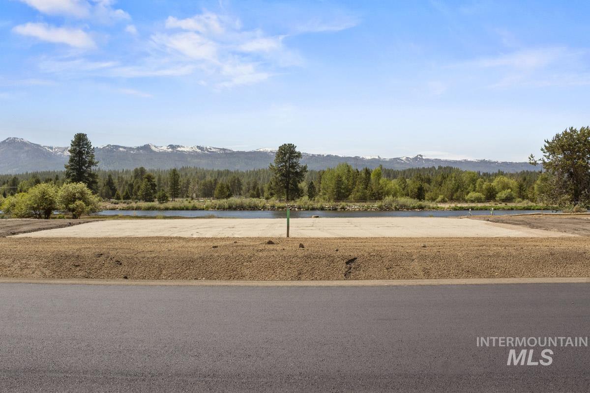 View of yard with a water and mountain view and a wooded view