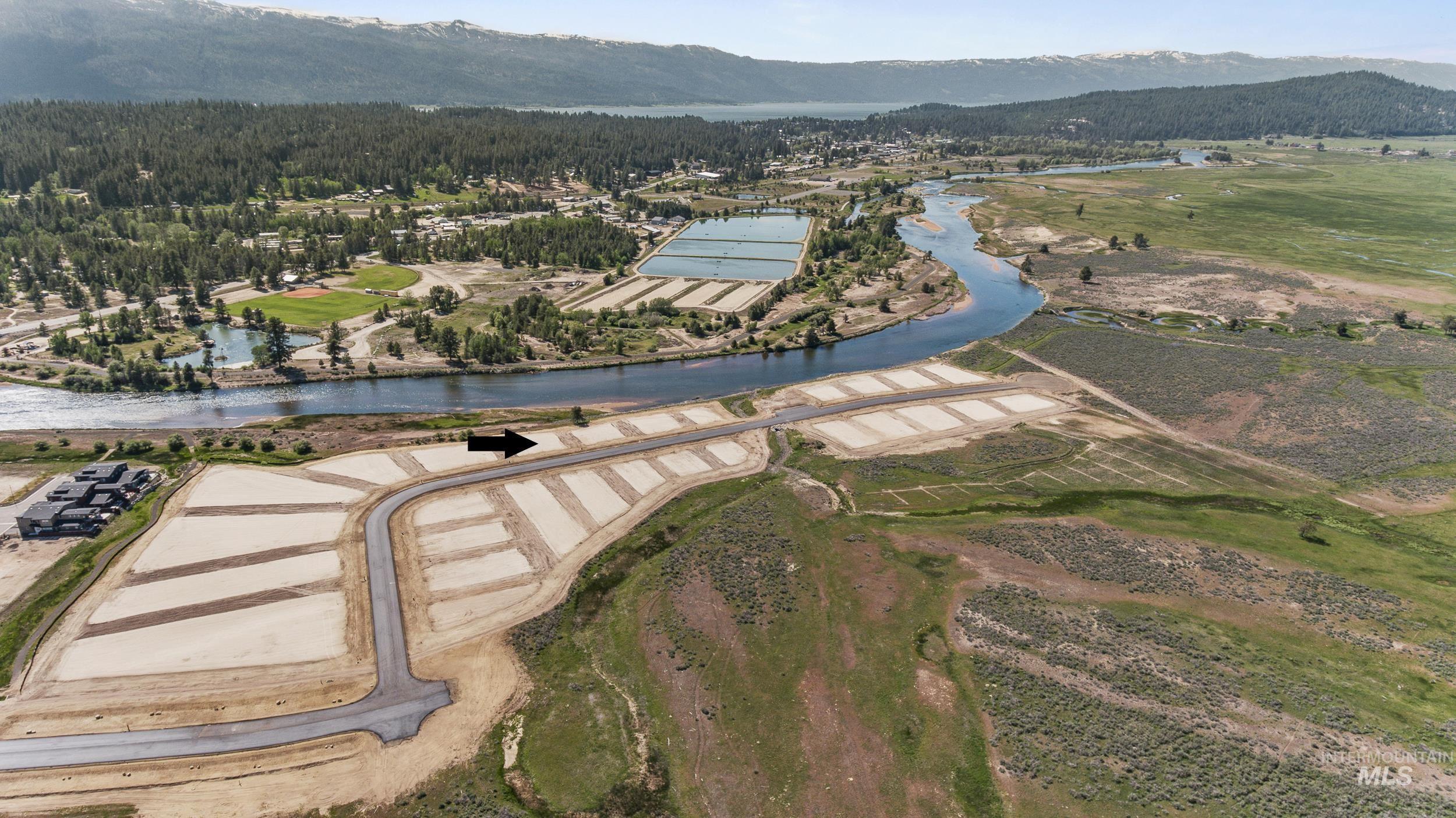 View of property location with a water and mountain view
