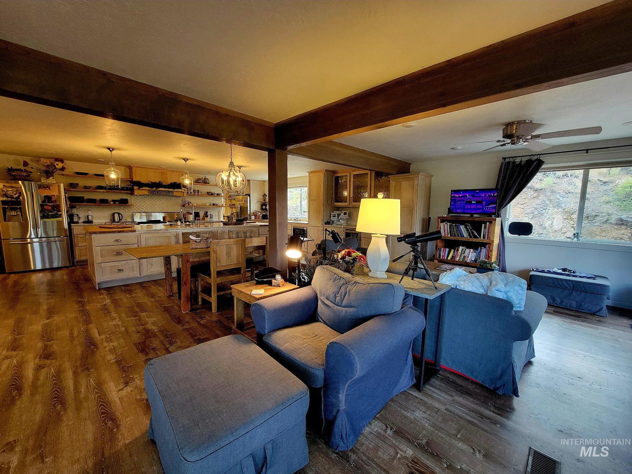 The living area is accented by a beam ceiling and furnished with IKEA pieces known for their durability and easy-to-swap covers?perfect when you?re ready for a fresh look