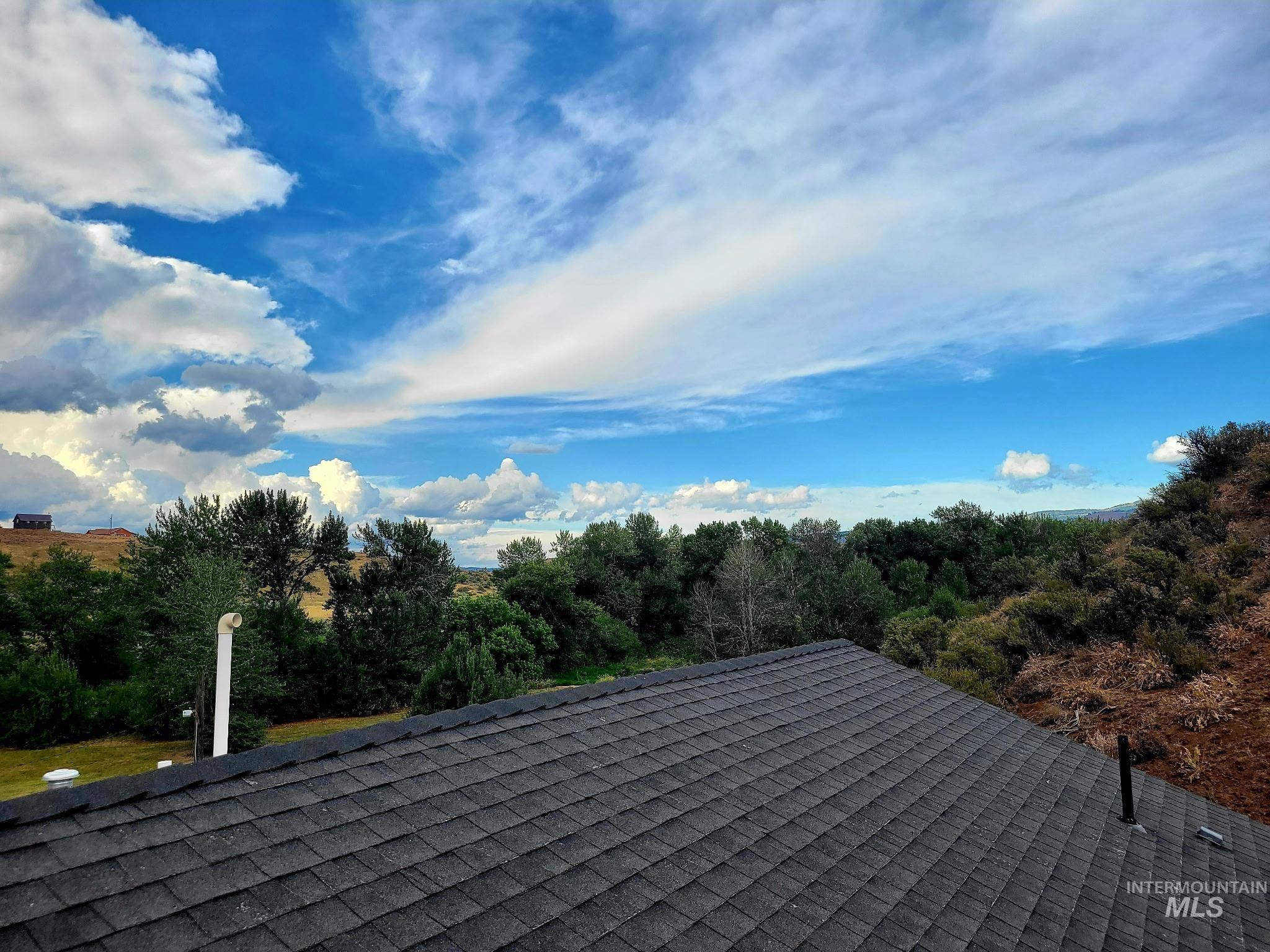 The roof is finished with beautiful composition tile, and its gentle slope allows for easy chimney access?and even a chance to take in the view while you?re there