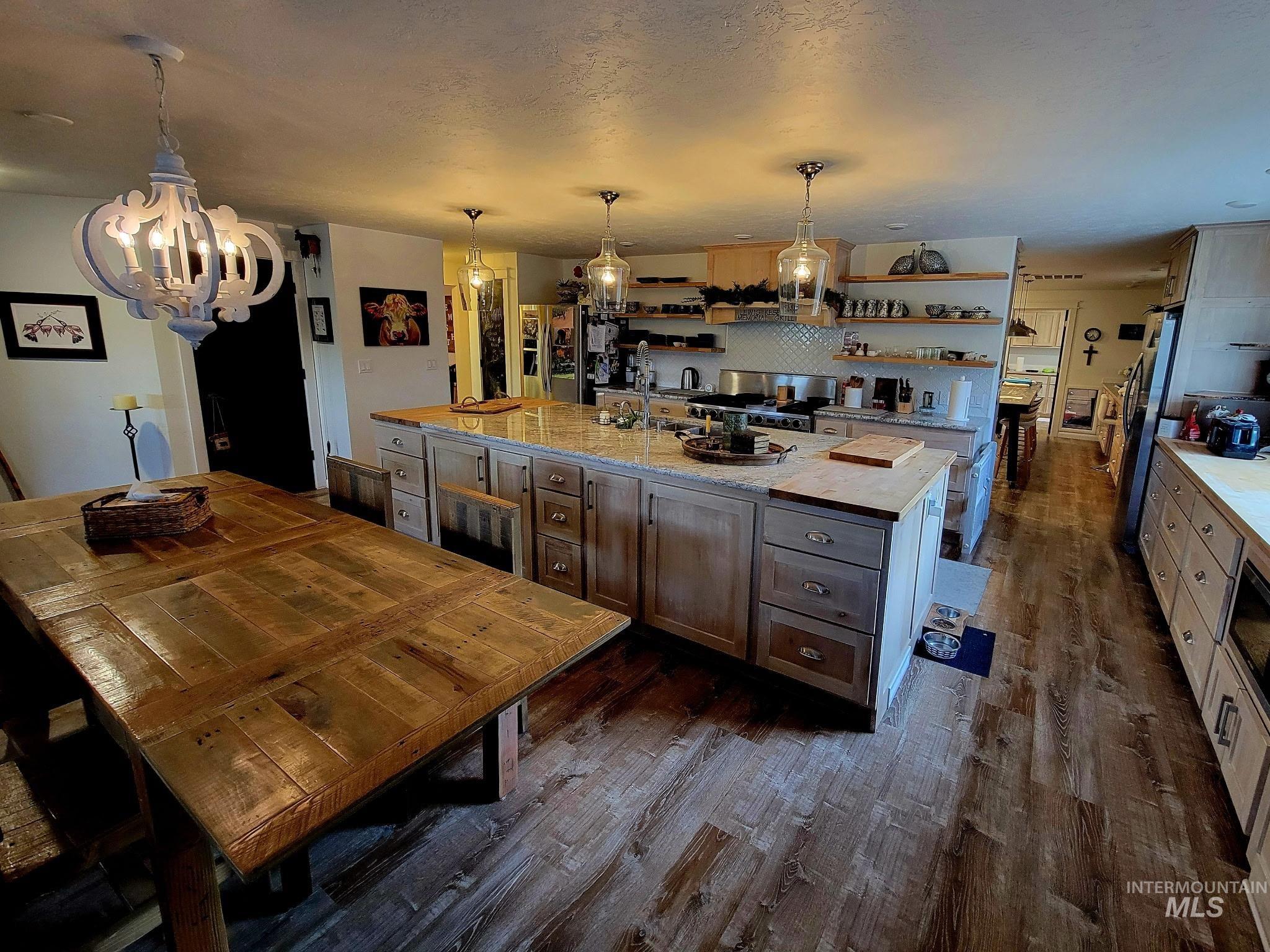 Meals turn into memories in a kitchen that offers both a big island for prep and a dining table fit for gatherings and storage for everything you need