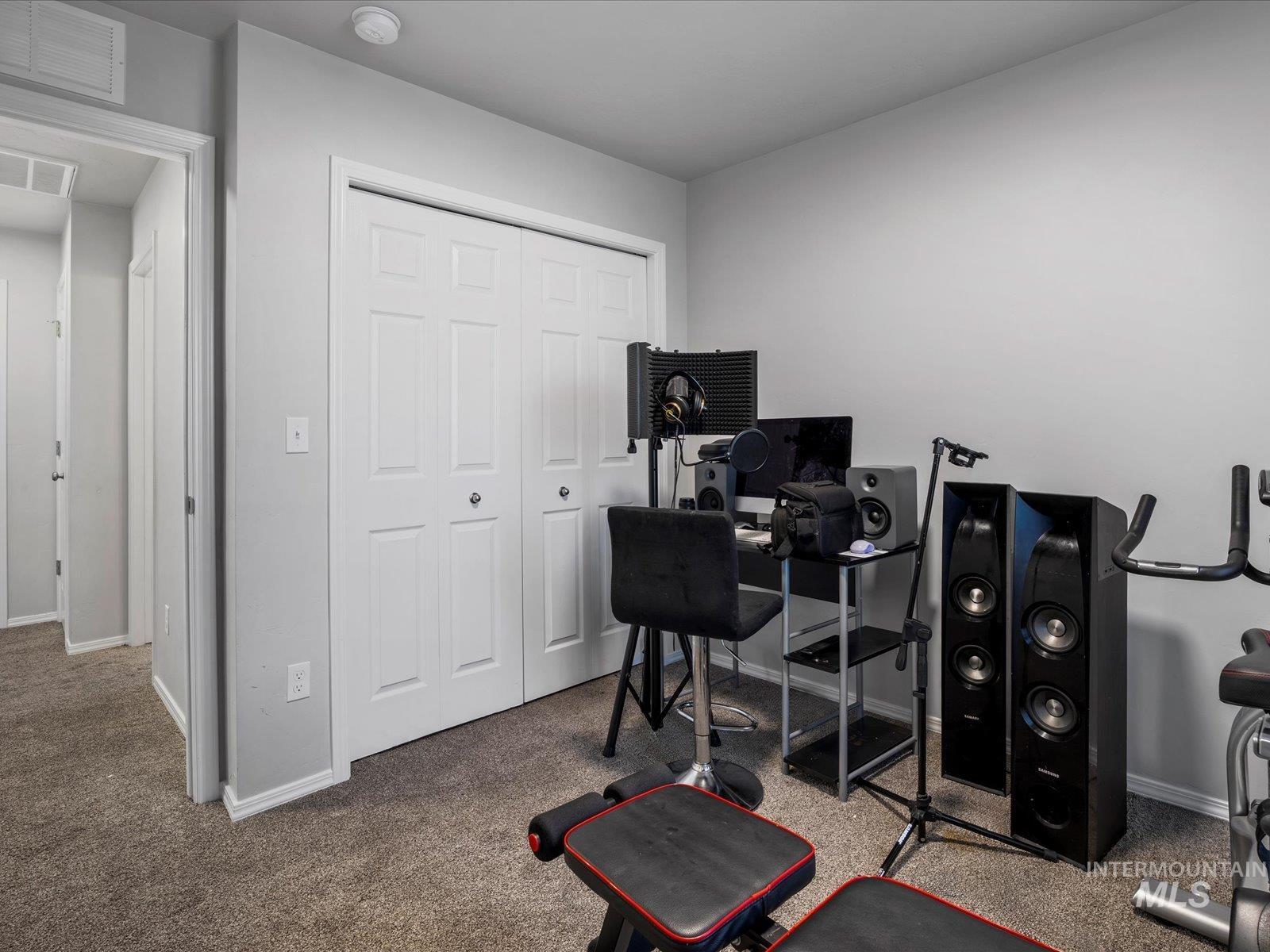 Workout room with carpet flooring