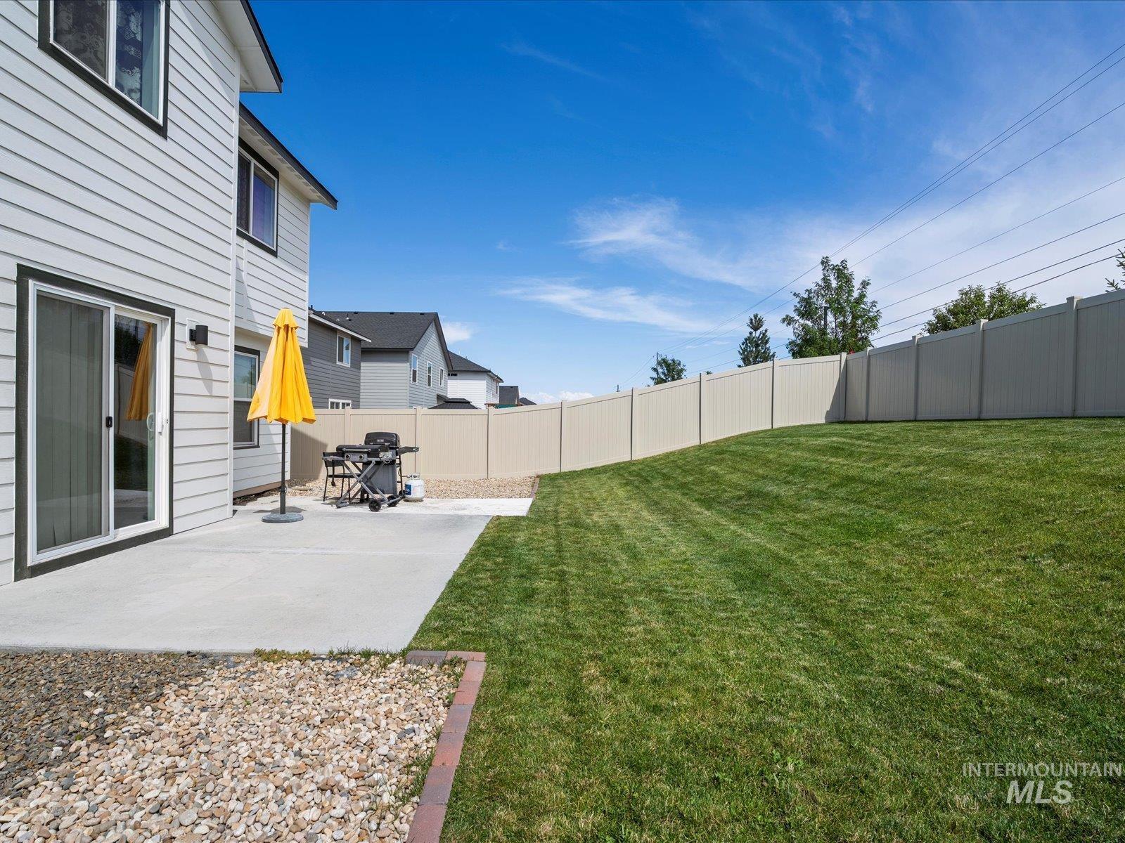 Fenced yard with a patio area