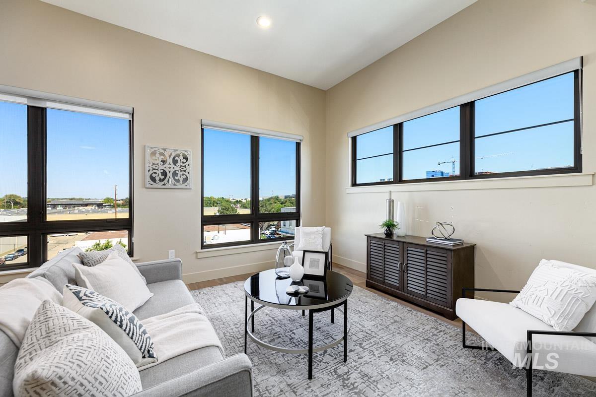 Living room featuring wood finished floors and recessed lighting
