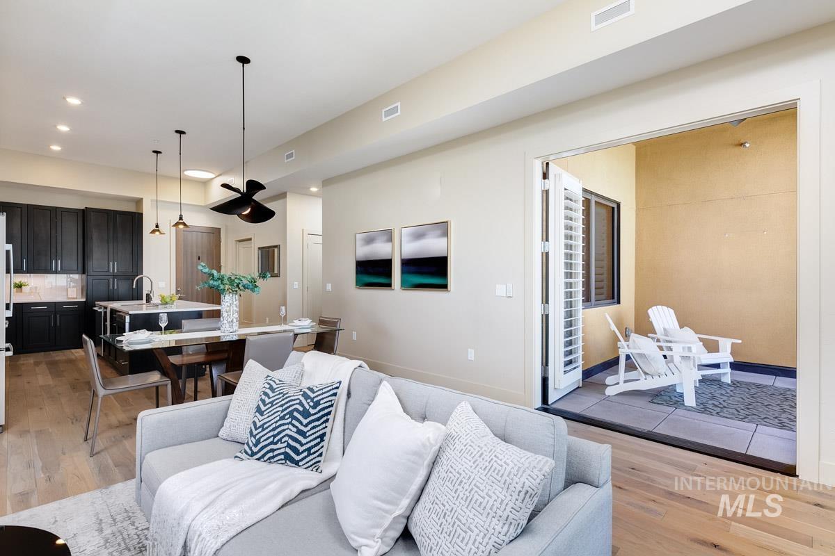 Living room featuring light wood-style floors and recessed lighting