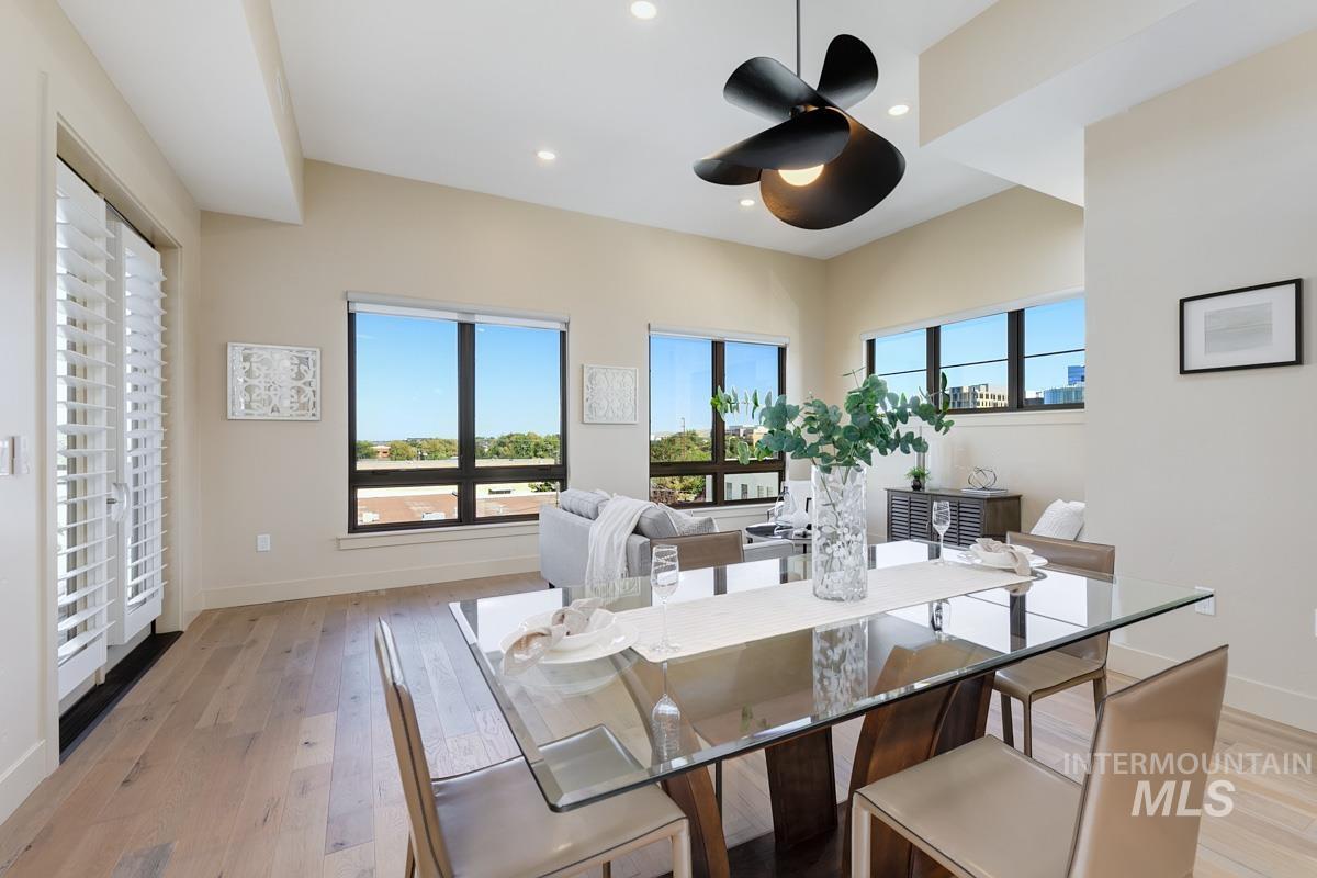 Dining space with recessed lighting, light wood finished floors, and a ceiling fan