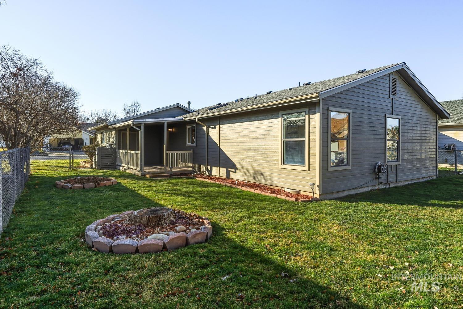 Rear view of house with a fire pit
