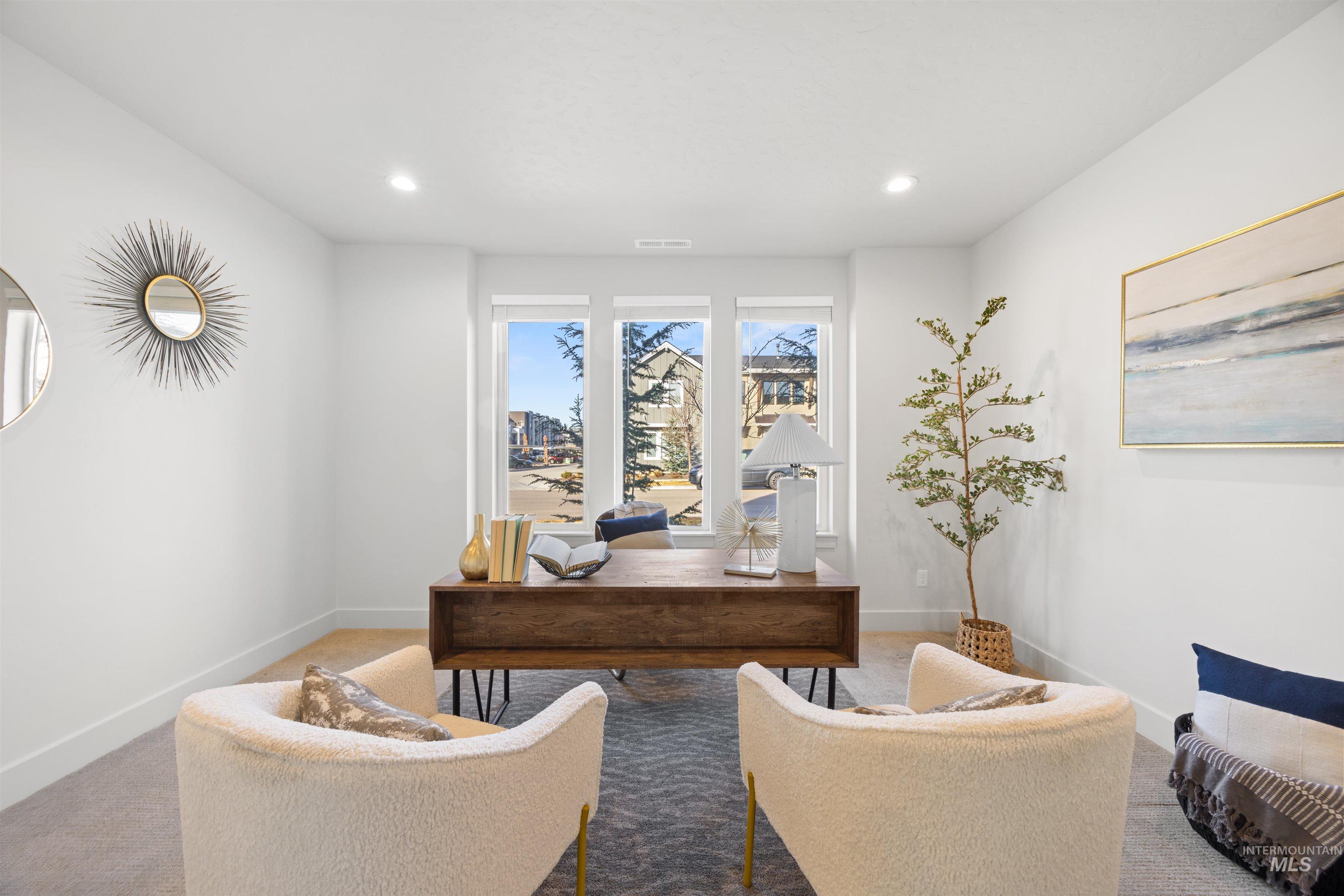 Carpeted home office with baseboards and recessed lighting