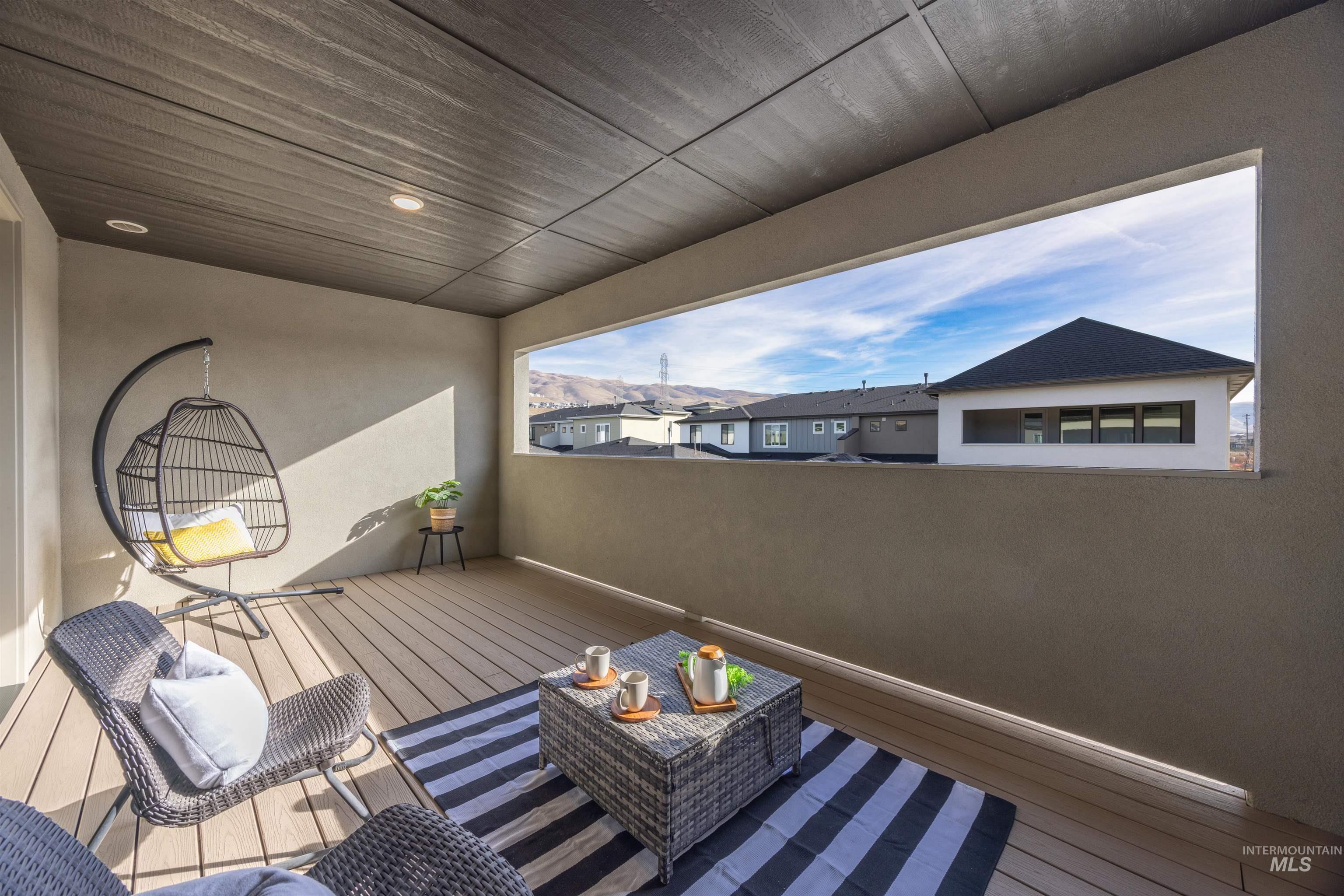 Wooden terrace featuring a residential view