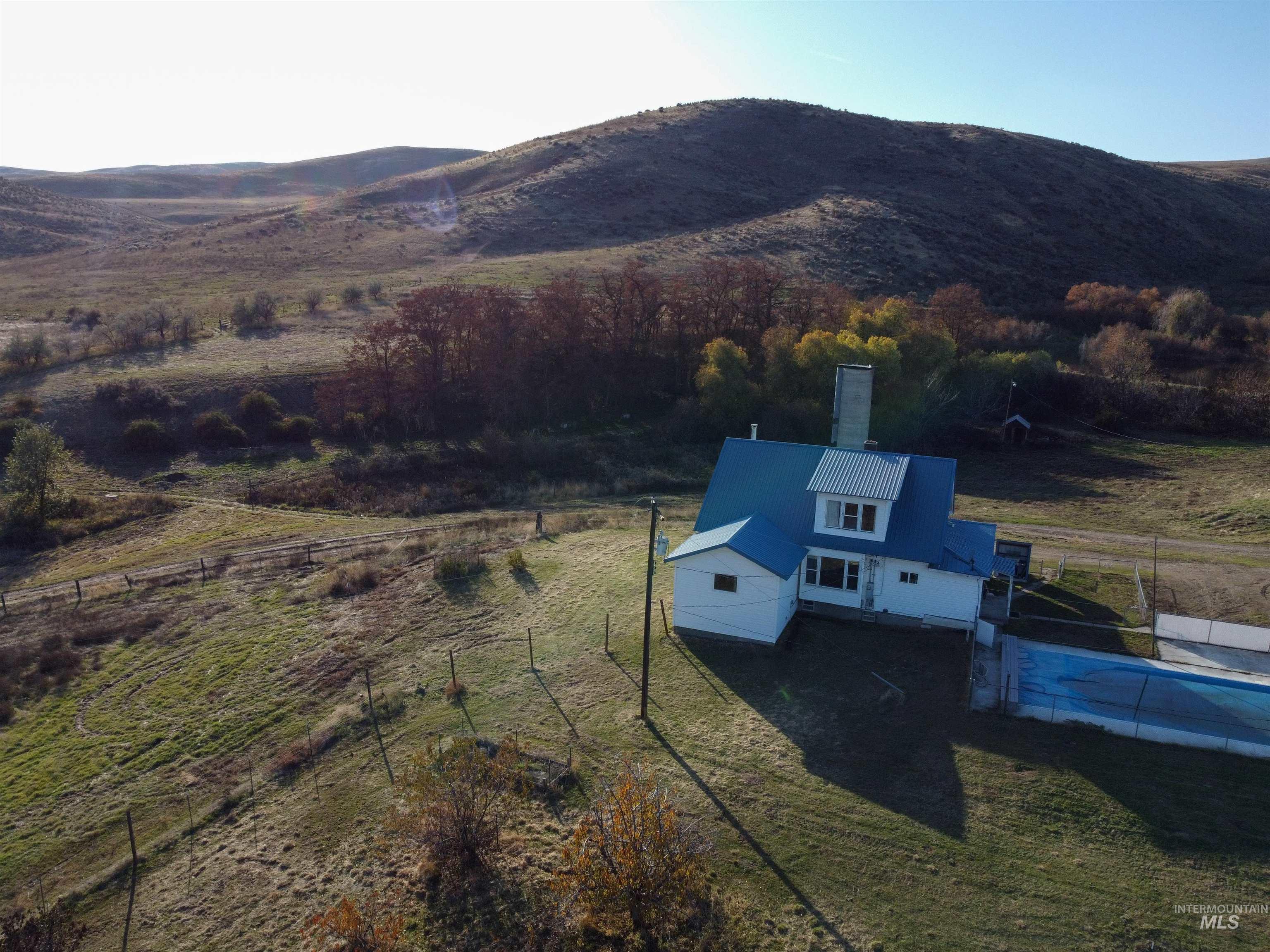 Overview of rural landscape with a mountain backdrop
