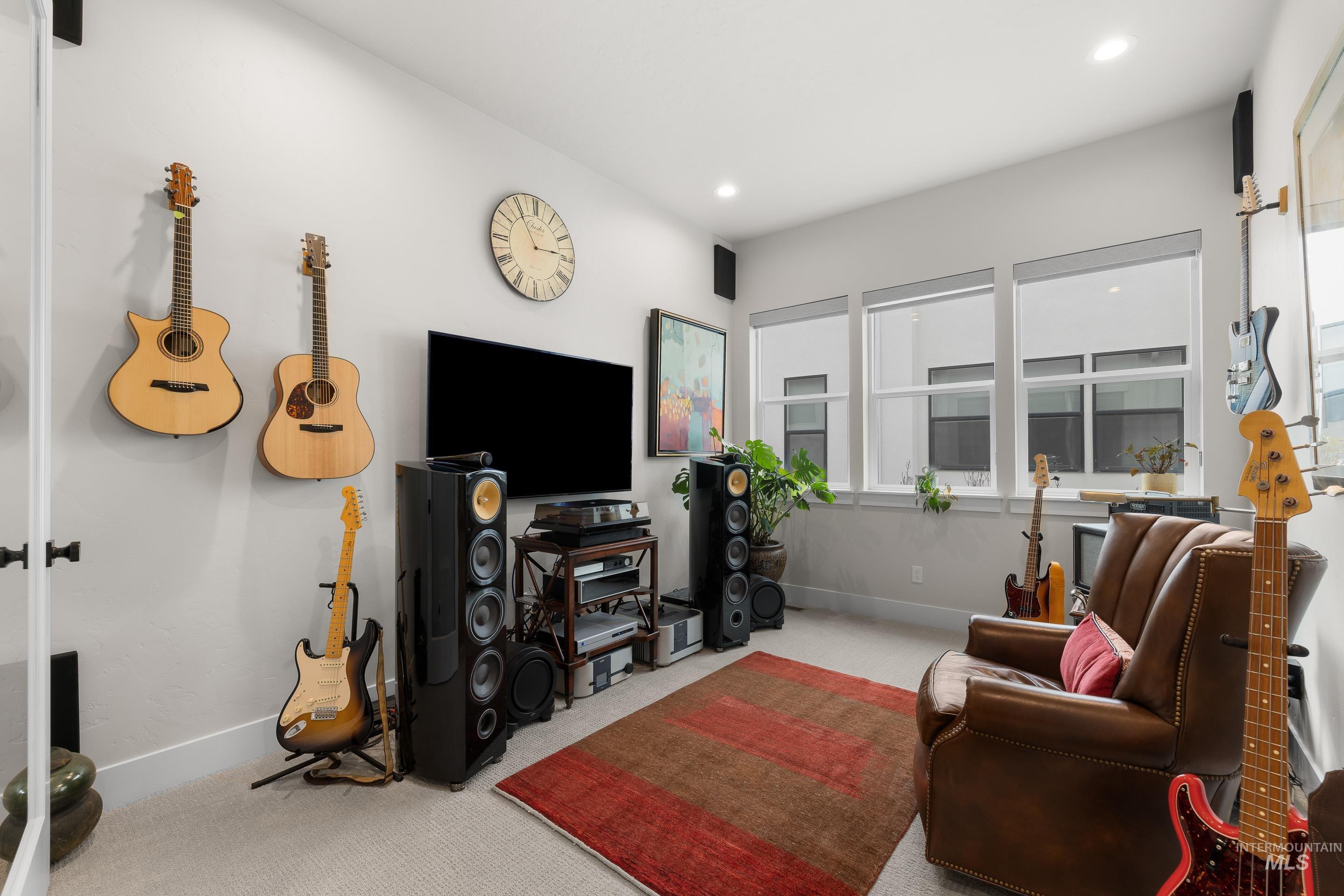 Living room featuring carpet and recessed lighting