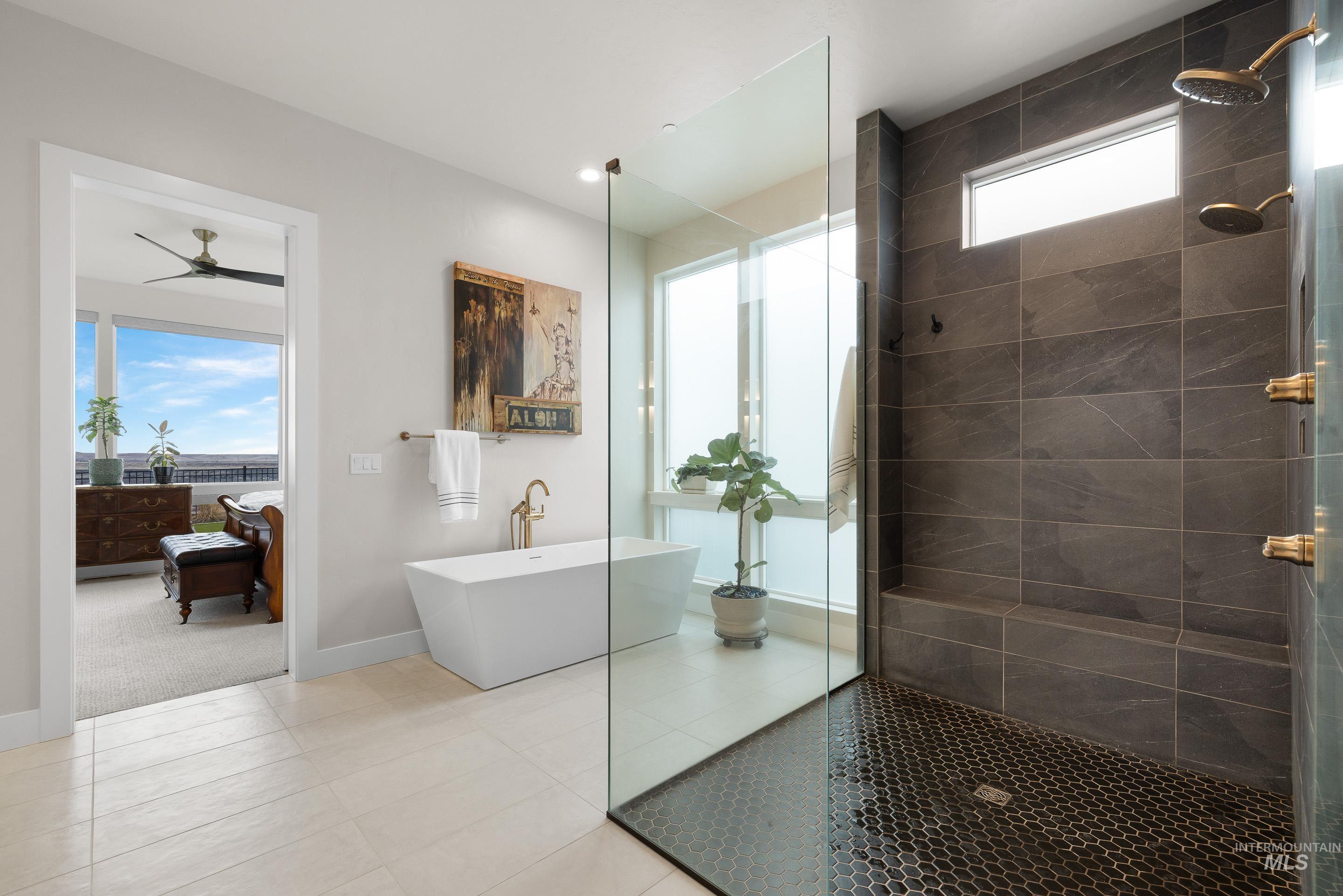 Full bath featuring walk in shower, tile patterned floors, a freestanding tub, and ceiling fan