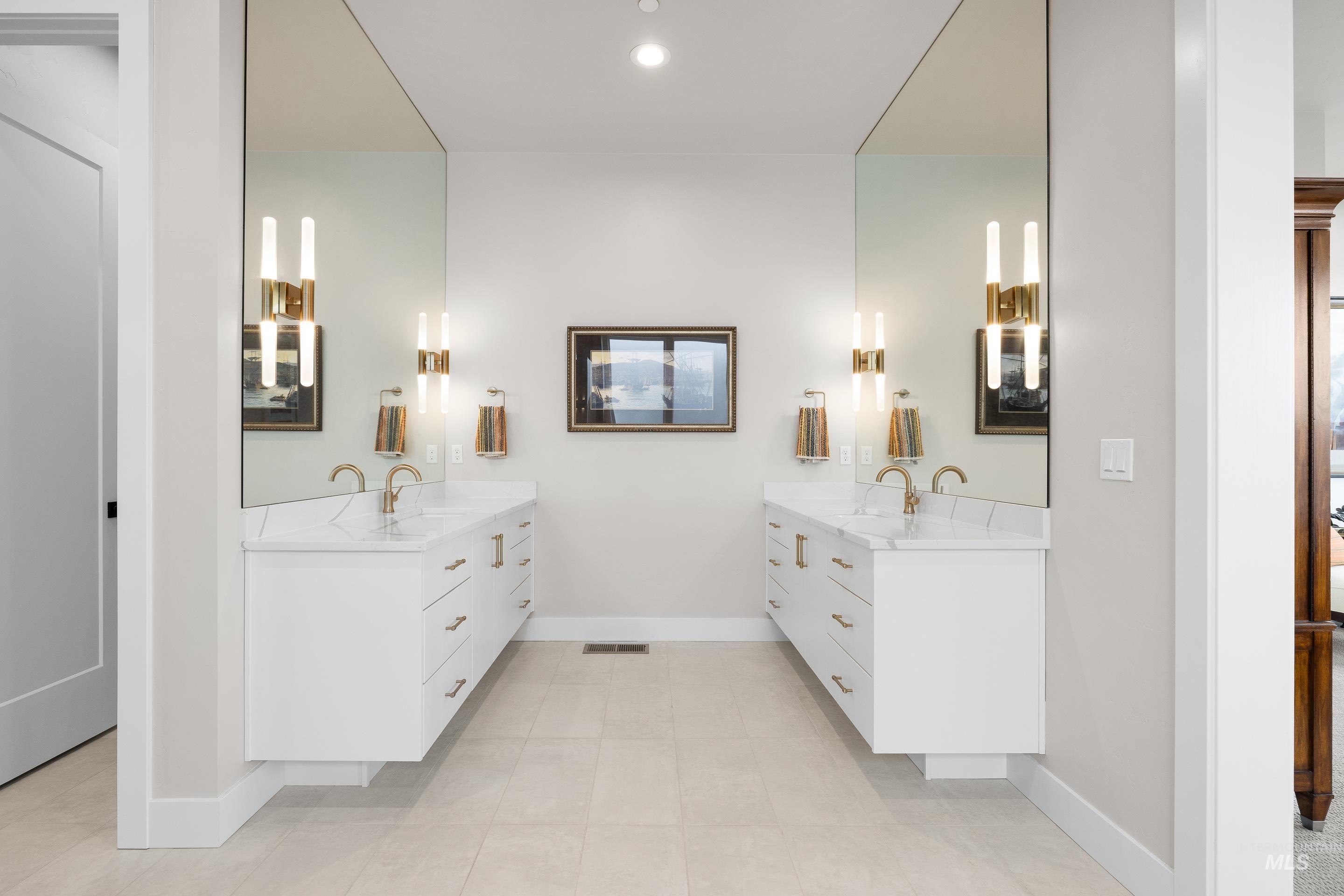 Full bath with two vanities, light tile patterned flooring, and recessed lighting