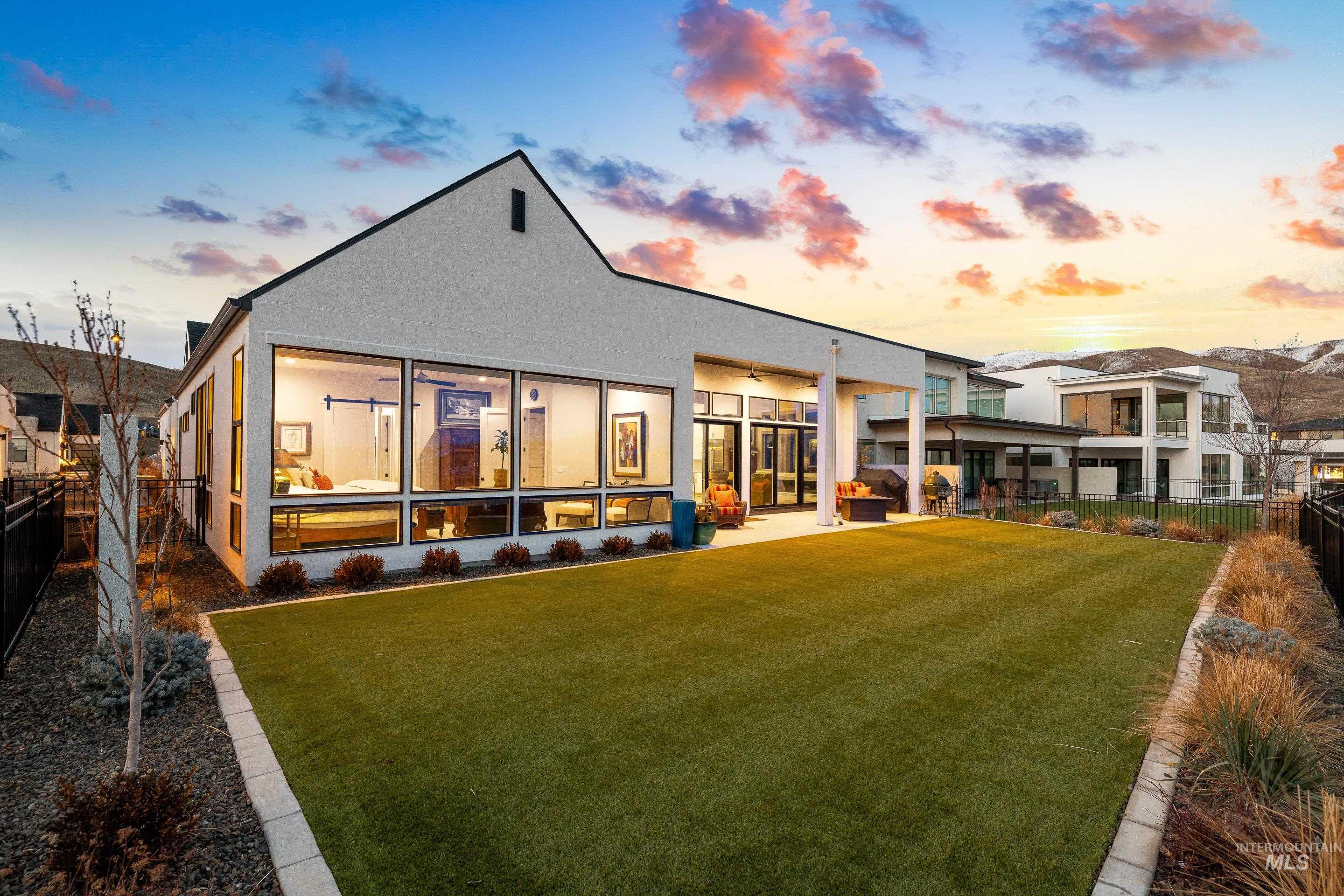 Back of house with a fenced backyard