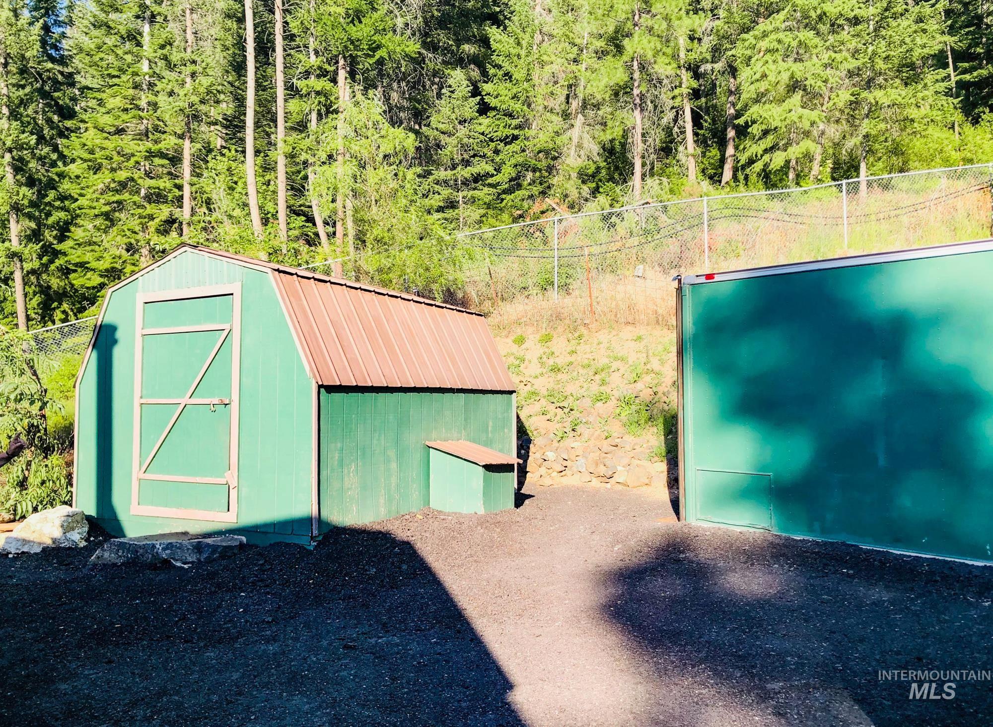 View of shed with a forest view