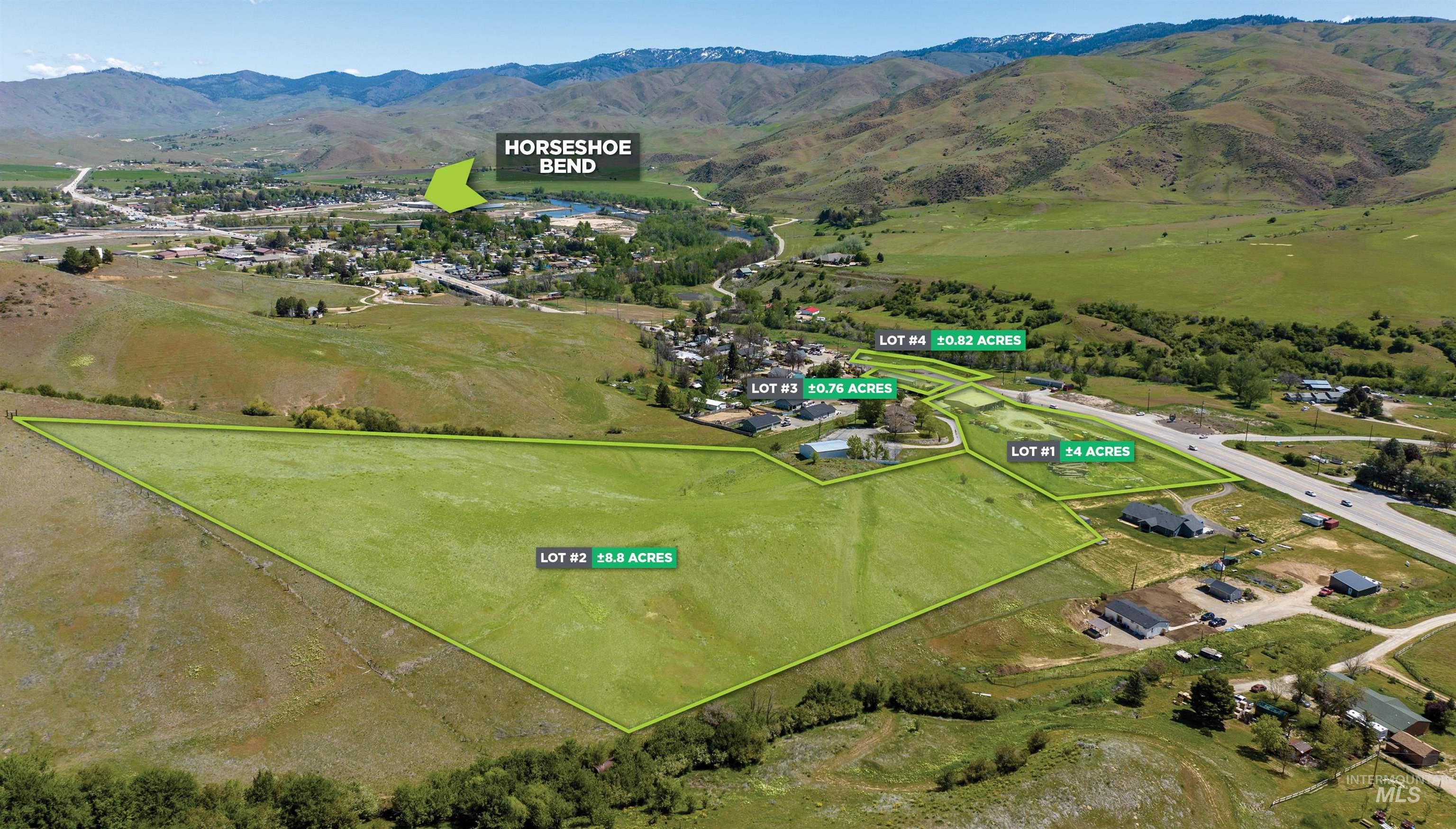 Aerial view of property's location featuring a mountainous background and property parcel outlined