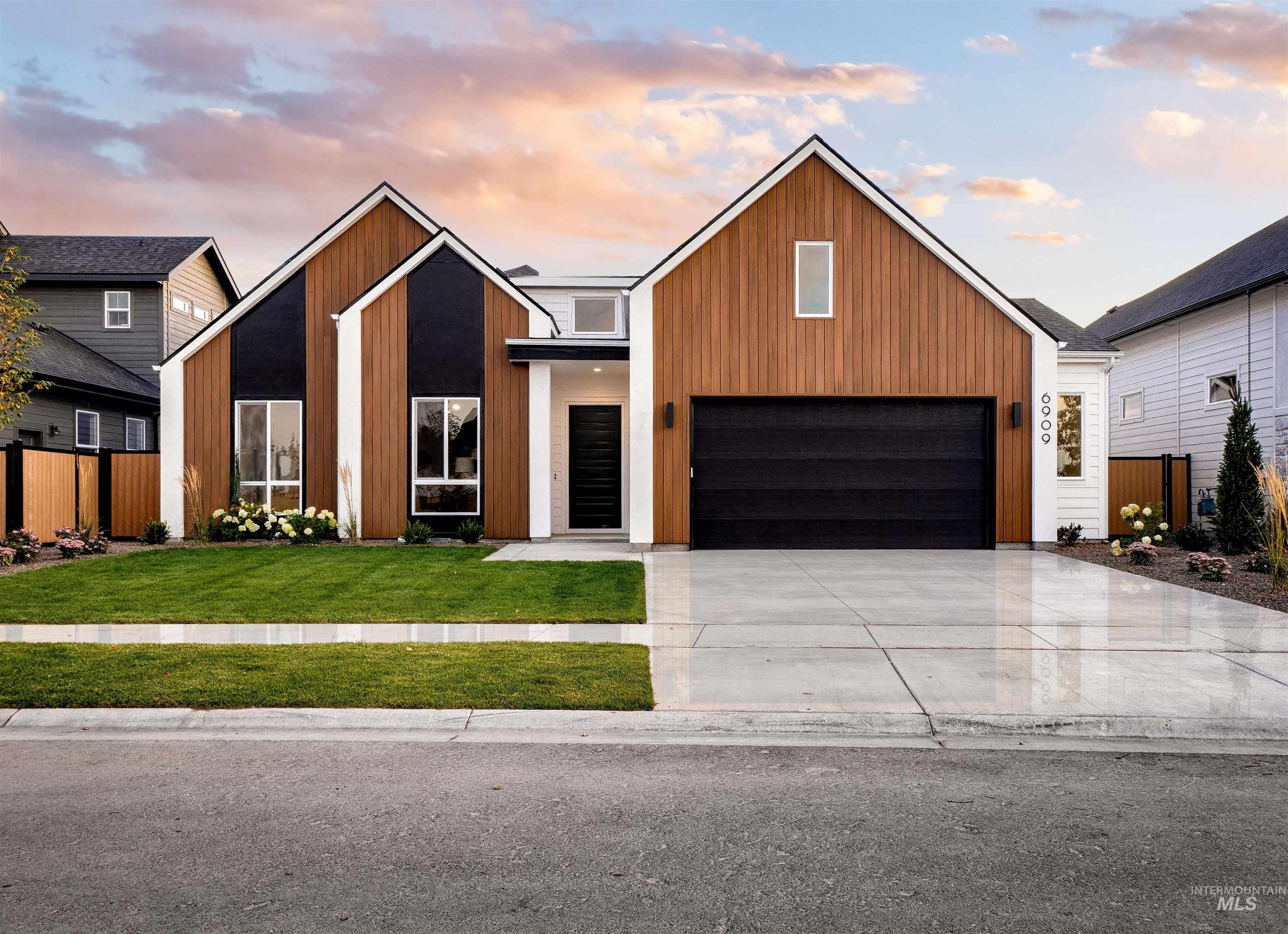 Contemporary house featuring driveway and a garage