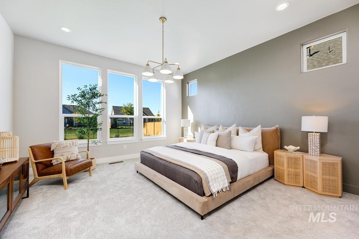 Bedroom with recessed lighting, carpet flooring, and a chandelier