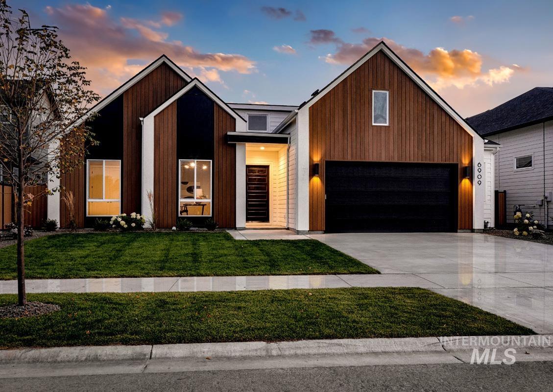 Modern home with driveway and a garage