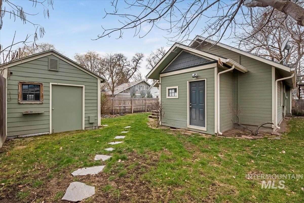 View of shed with a fenced backyard