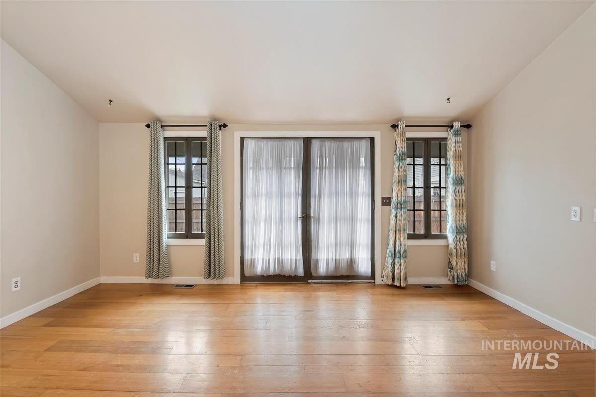 Unfurnished room featuring light wood finished floors