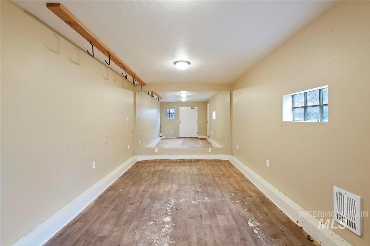 Below grade area with wood finished floors and baseboards