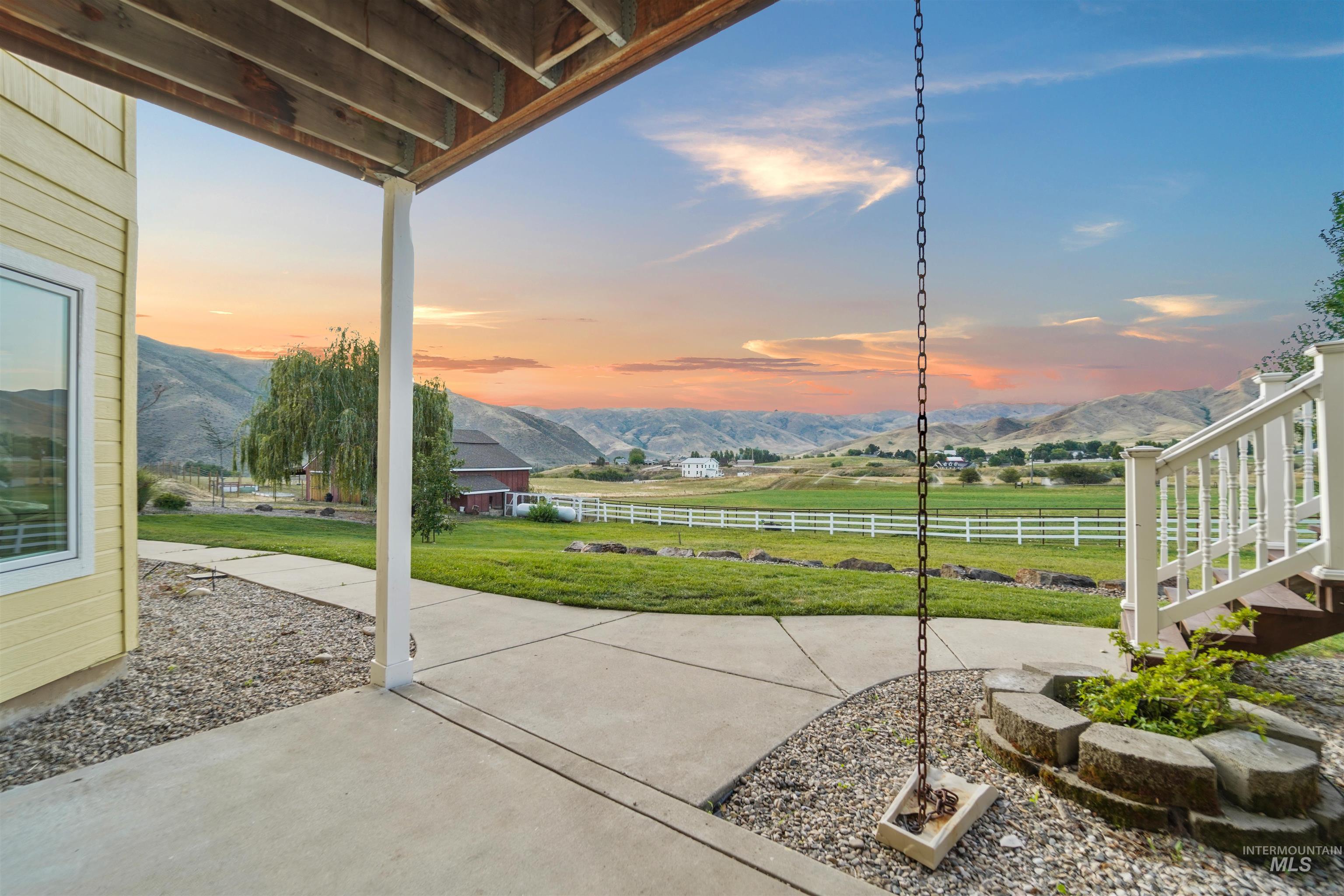 View of patio / terrace featuring a mountain view and a view of countryside