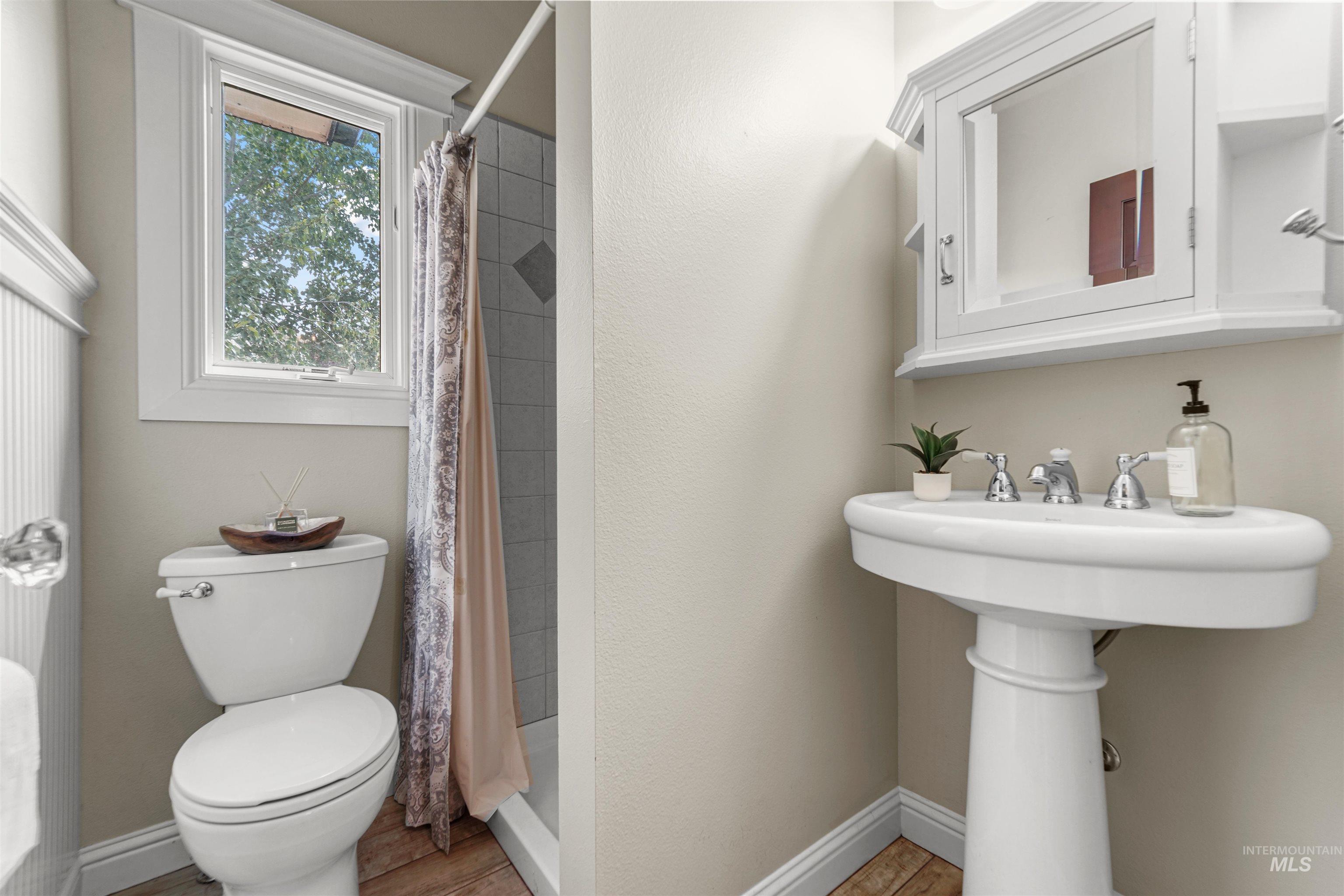 Full bath with tiled shower