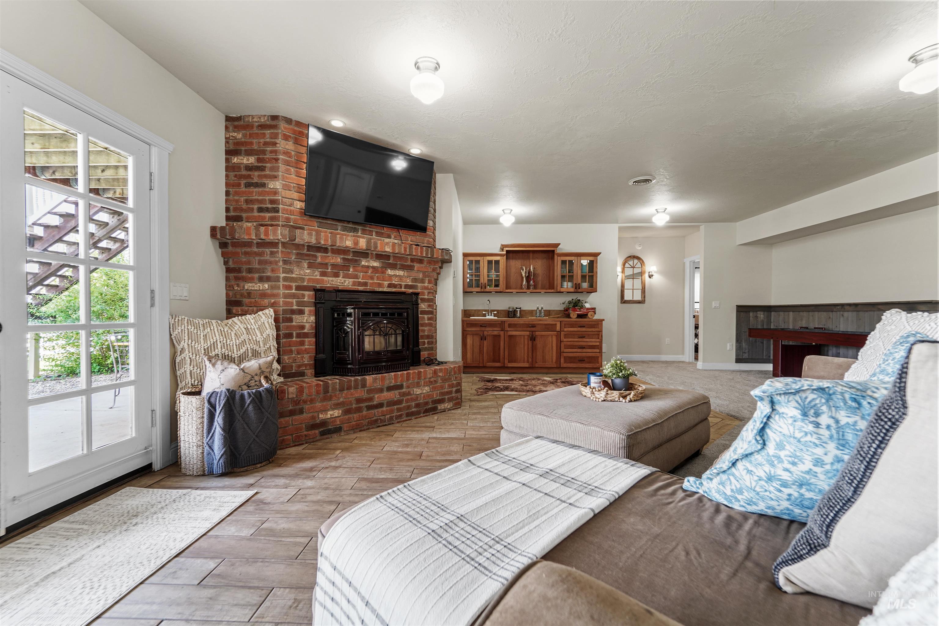 Living room featuring a fireplace and light wood-style floors