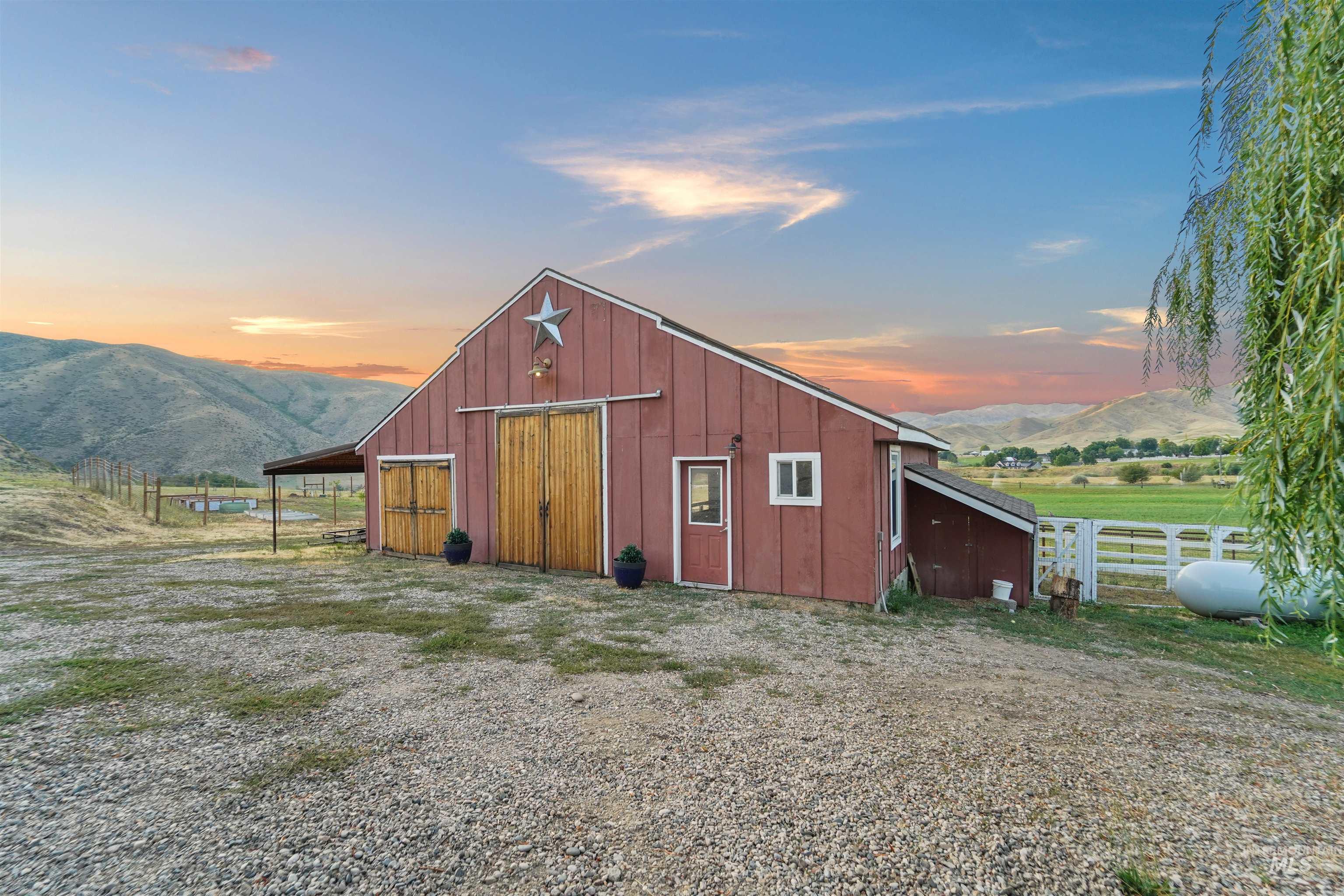 View of outdoor structure with a mountain view and a rural view