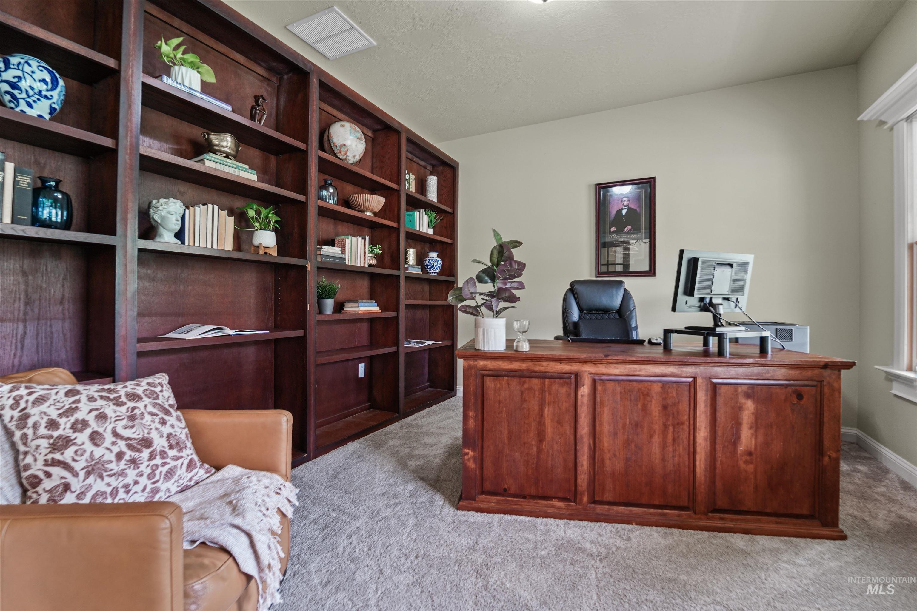 Office area with carpet flooring
