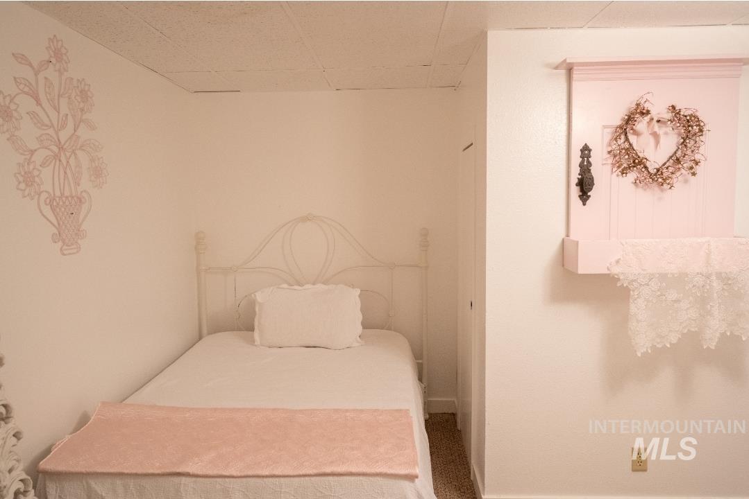 Bedroom featuring a paneled ceiling