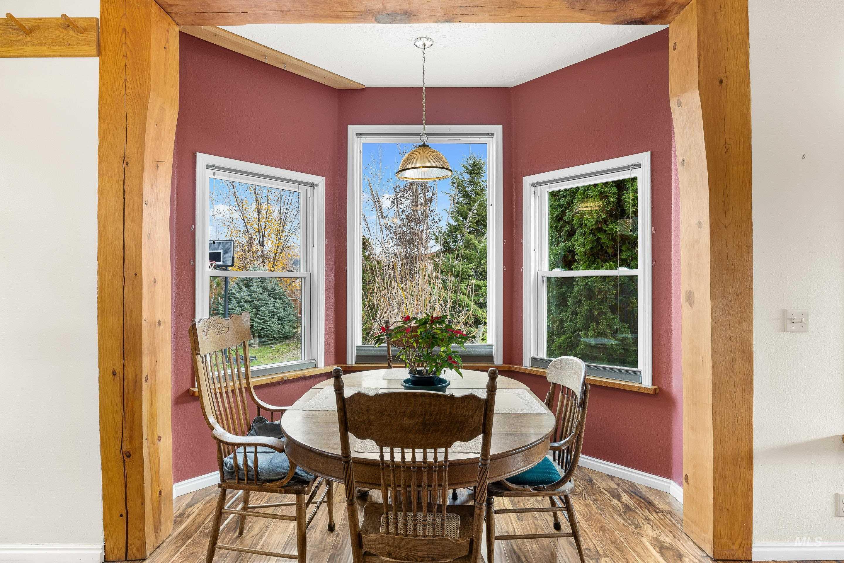 Dining room with wood finished floors and baseboards