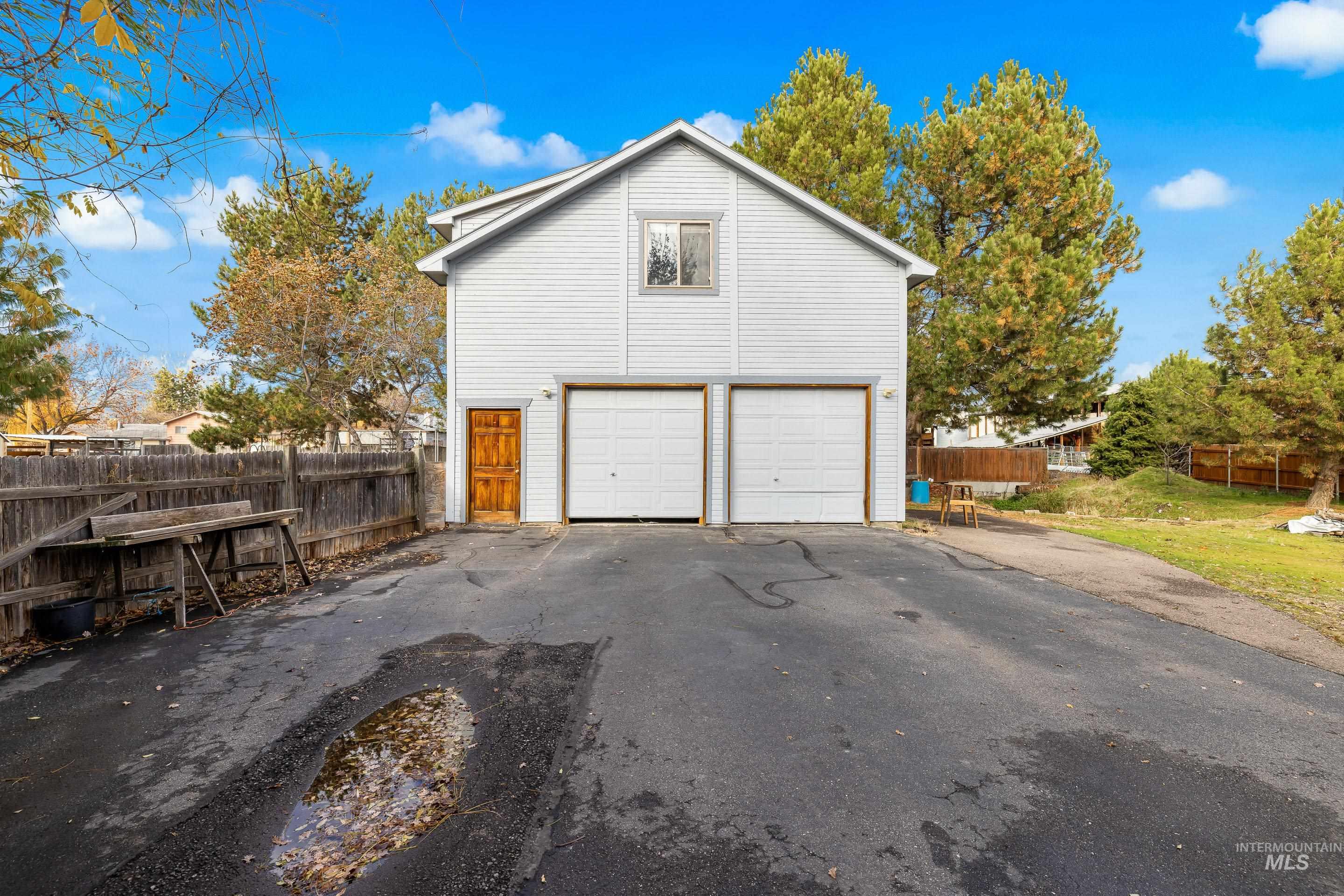 Garage featuring driveway