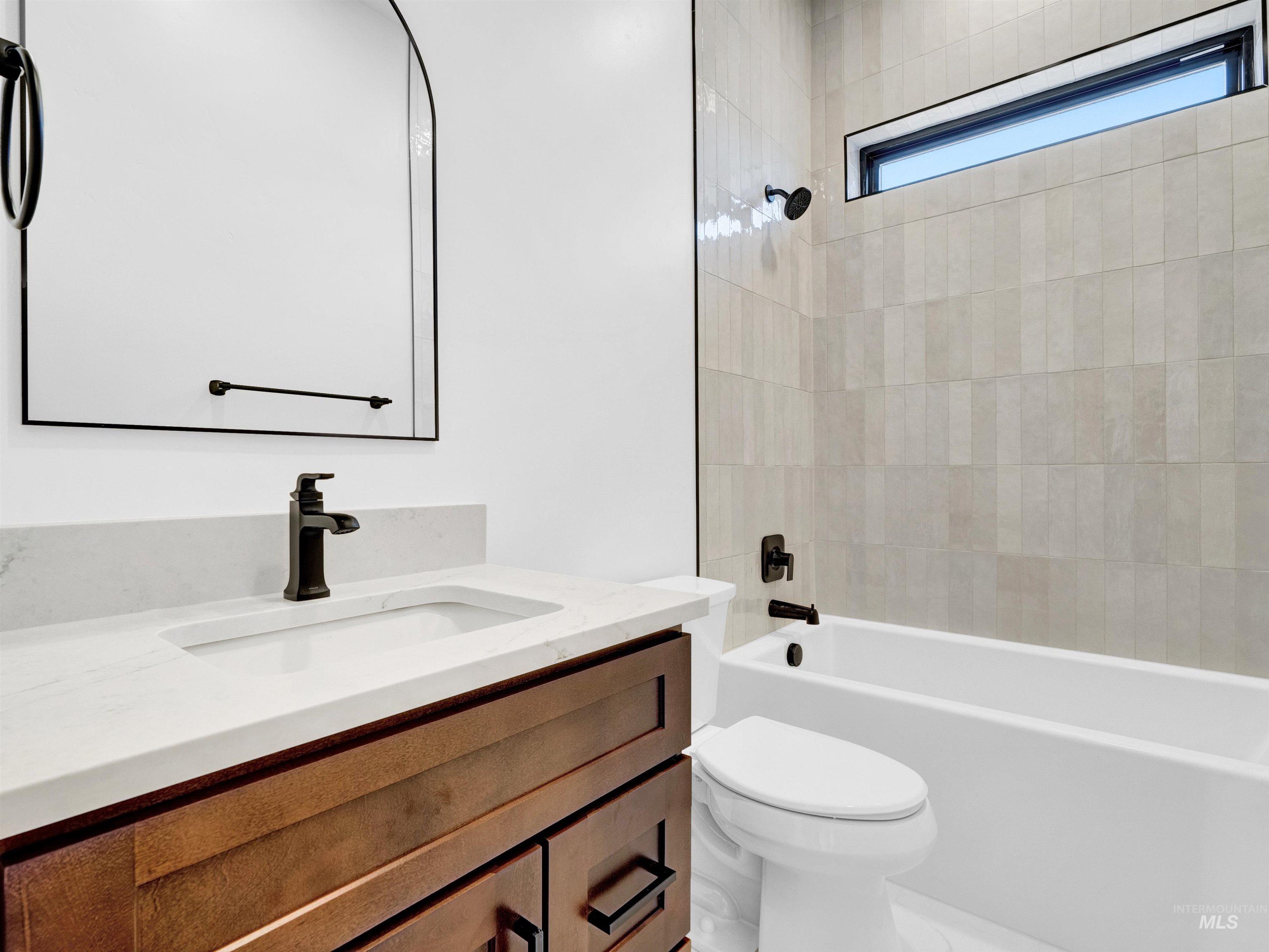 Full bathroom with vanity and shower / bath combination