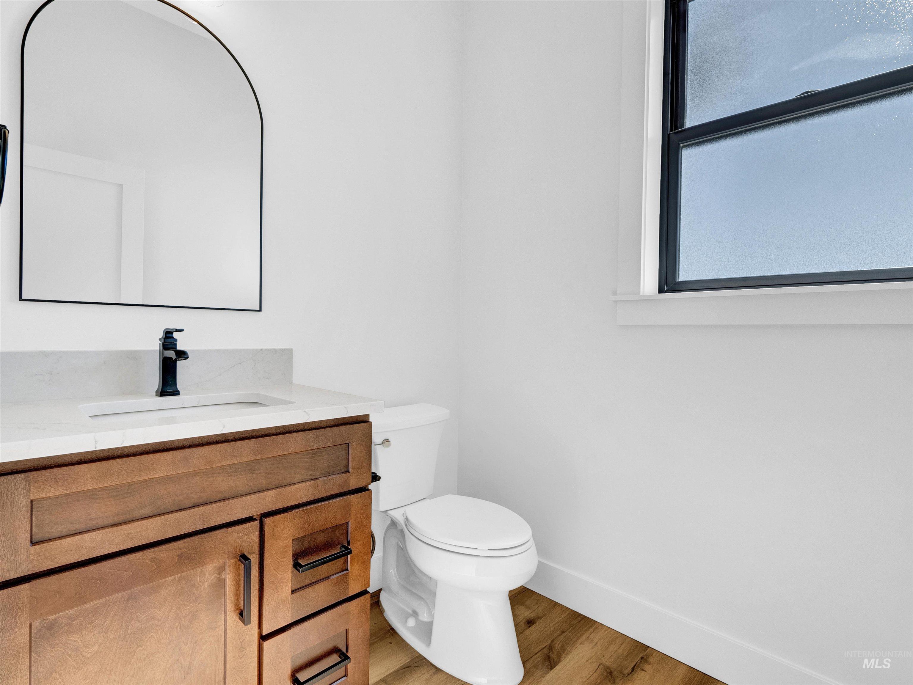 Bathroom with vanity and wood finished floors