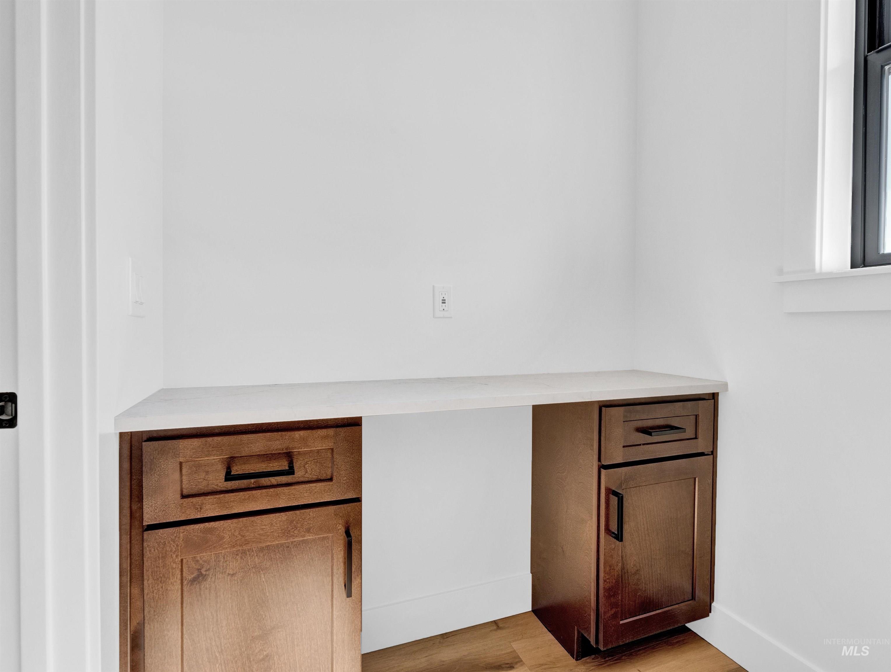 Detailed view of wood finished floors and baseboards