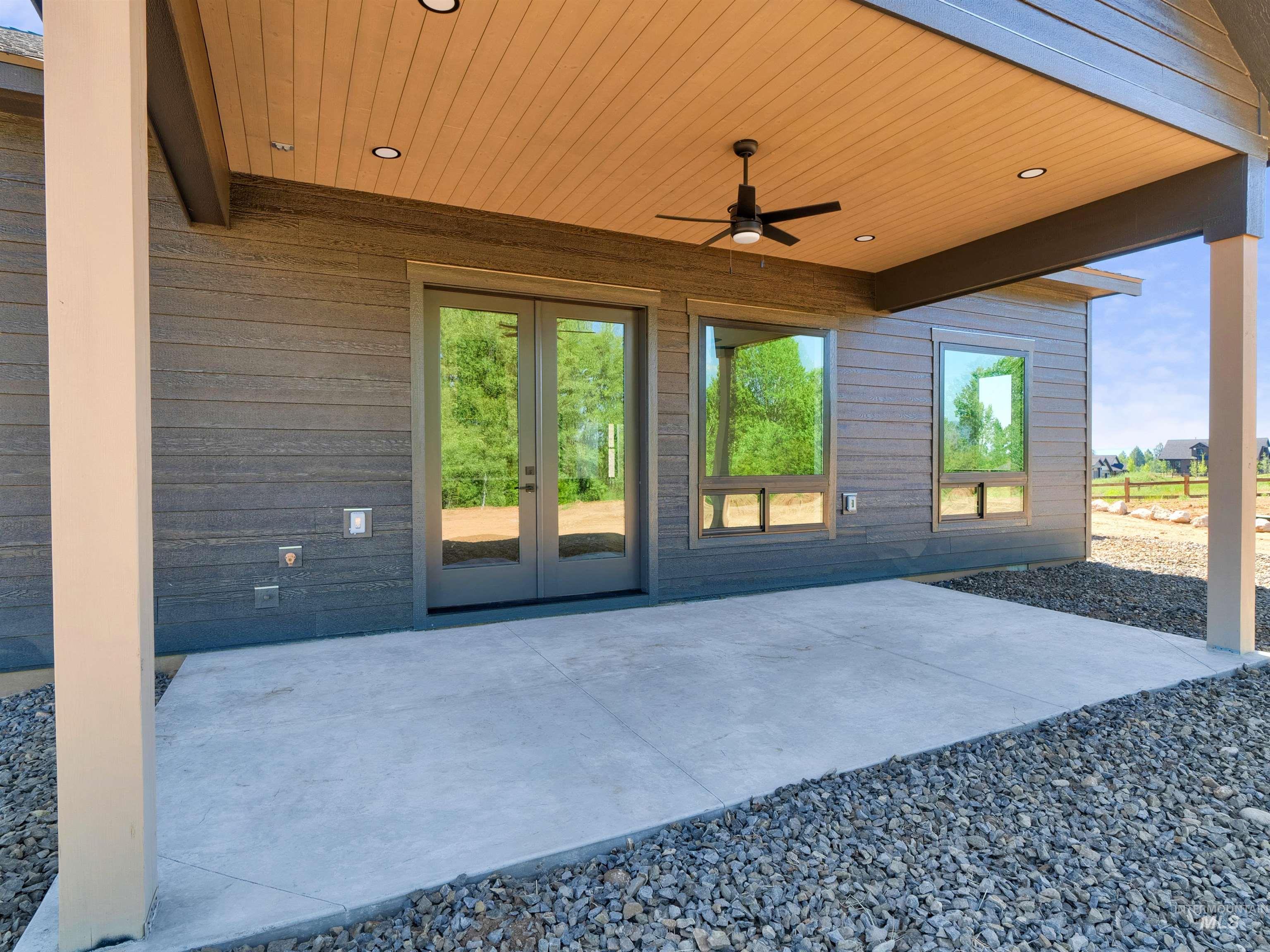 View of patio / terrace with french doors and ceiling fan